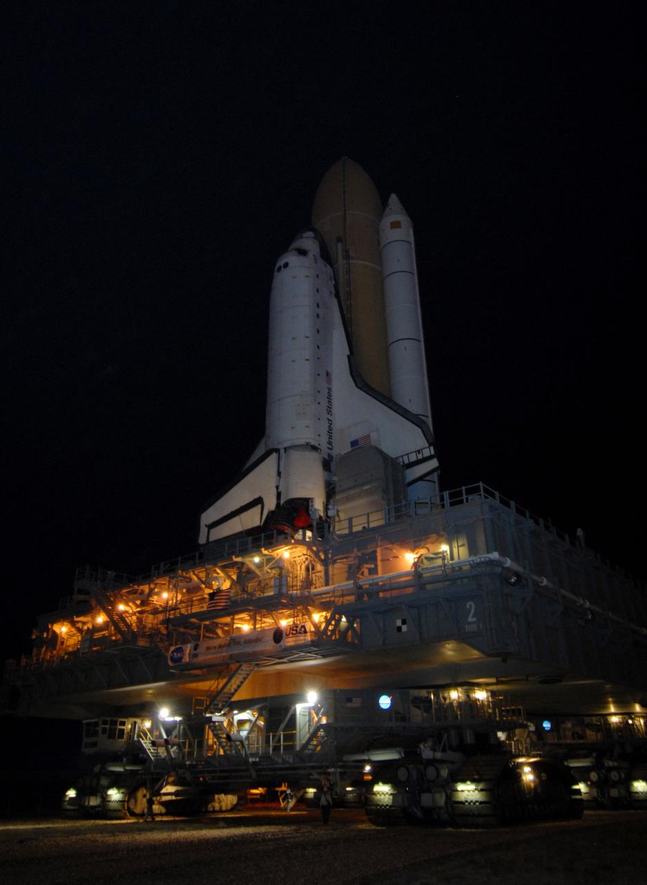 CAPE CANAVERAL, Fla. – Space shuttle Atlantis moves along the crawlerway at NASA's Kennedy Space Center in Florida on its rollout to Launch Pad 39A. Atlantis is targeted to lift off May 12 to service NASA's Hubble Space Telescope. First motion was at 3:54 a.m. EDT. The 3.4-mile trip will take about six hours. During Atlantis' 11-day mission, the crew of seven astronauts will make the final shuttle flight to Hubble. During five spacewalks, they will install two new instruments, repair two inactive ones and replace components. The result will be six working, complementary science instruments with capabilities beyond what is now available, and an extended operational lifespan for the telescope through at least 2014.   Photo credit: NASA/Jack Pfaller