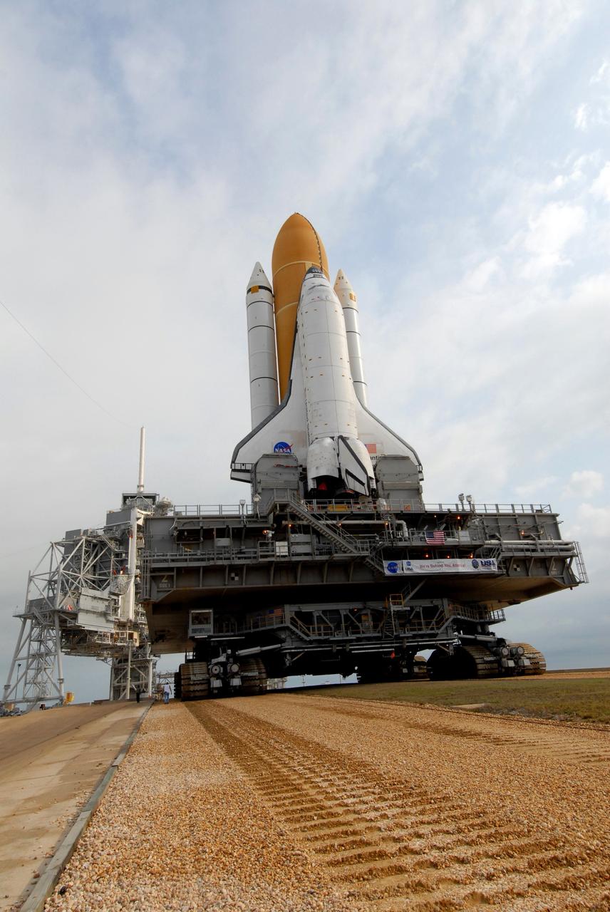 CAPE CANAVERAL, Fla. – Space shuttle Atlantis slowly makes its way to the top of Launch Pad 39A at NASA's Kennedy Space Center in Florida after rollout from the Vehicle Assembly Building. The shuttle sits atop the mobile launcher platform, which is carried by the crawler-transporter beneath. First motion was at 3:54 a.m. EDT and Atlantis was secured on the pad at 11:17 a.m. The 3.4-mile trip took about seven-and-a-half hours. Atlantis is targeted to lift off May 12 to service NASA's Hubble Space Telescope. During Atlantis' 11-day mission, the crew of seven astronauts will make the final shuttle flight to Hubble. During five spacewalks, they will install two new instruments, repair two inactive ones and replace components. The result will be six working, complementary science instruments with capabilities beyond what is now available, and an extended operational lifespan for the telescope through at least 2014.   Photo credit: NASA/Jack Pfaller