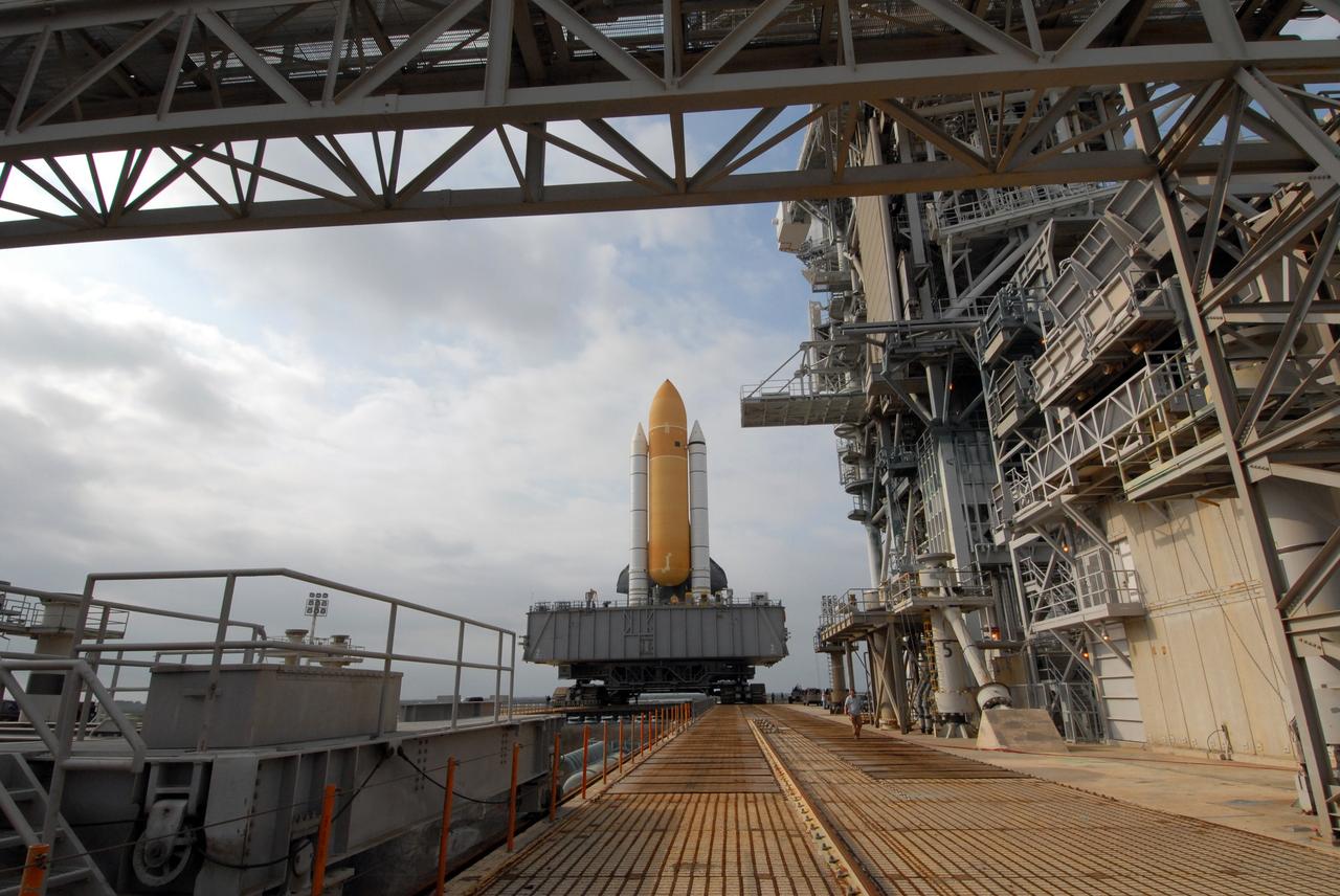 CAPE CANAVERAL, Fla. – Space shuttle Atlantis slowly crawls across the top of Launch Pad 39A at NASA's Kennedy Space Center in Florida after rollout from the Vehicle Assembly Building. The shuttle sits atop the mobile launcher platform, which is carried by the crawler-transporter beneath.  First motion was at 3:54 a.m. EDT and Atlantis was secured on the pad at 11:17 a.m. The 3.4-mile trip took about seven-and-a-half hours. Atlantis is targeted to lift off May 12 to service NASA's Hubble Space Telescope. During Atlantis' 11-day mission, the crew of seven astronauts will make the final shuttle flight to Hubble. During five spacewalks, they will install two new instruments, repair two inactive ones and replace components. The result will be six working, complementary science instruments with capabilities beyond what is now available, and an extended operational lifespan for the telescope through at least 2014.   Photo credit: NASA/Jack Pfaller