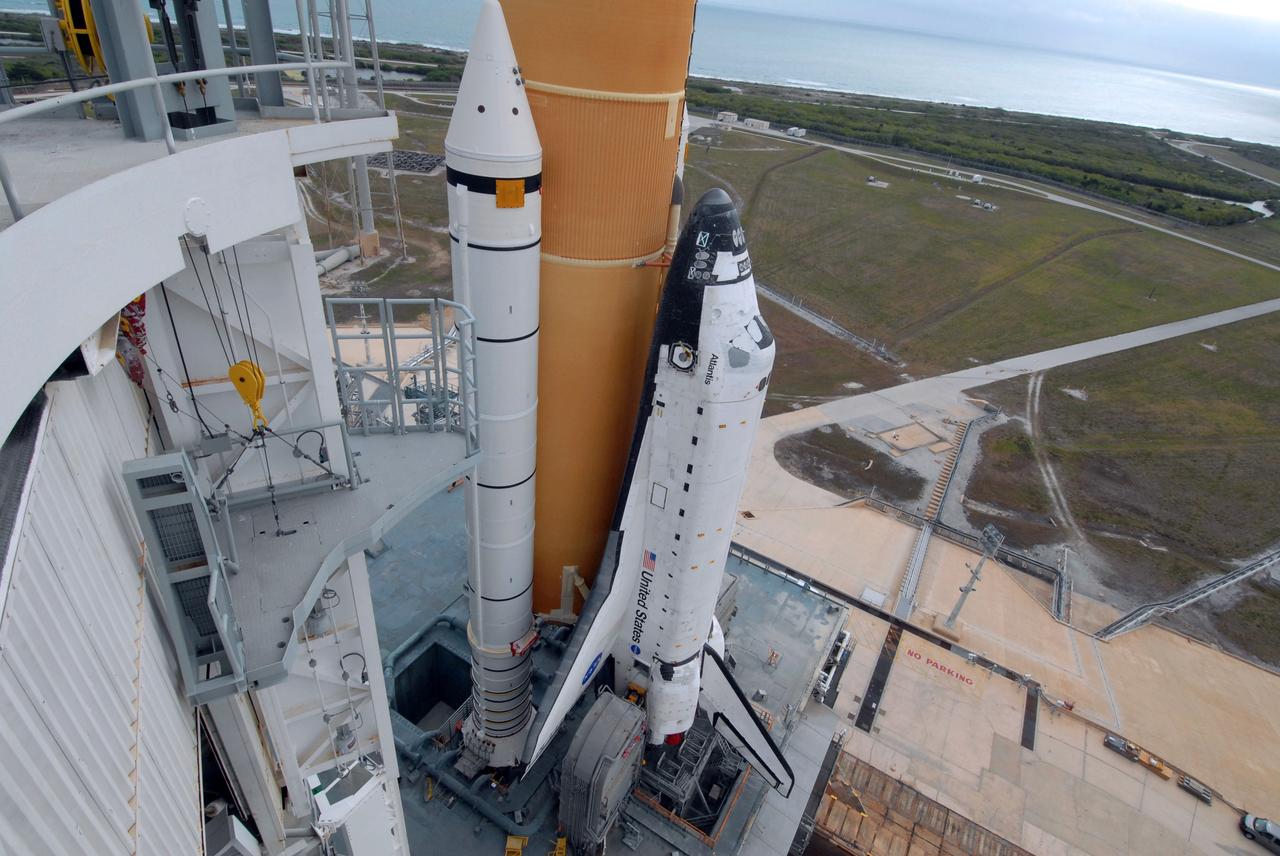 CAPE CANAVERAL, Fla. – Space shuttle Atlantis slowly reaches the top of Launch Pad 39A at NASA's Kennedy Space Center in Florida after rollout from the Vehicle Assembly Building. The shuttle sits atop the mobile launcher platform, which is carried by the crawler-transporter beneath. Beyond the shuttle on the horizon is the Atlantic Ocean. First motion was at 3:54 a.m. EDT and Atlantis was secured on the pad at 11:17 a.m. The 3.4-mile trip took about seven-and-a-half hours. Atlantis is targeted to lift off May 12 to service NASA's Hubble Space Telescope. During Atlantis' 11-day mission, the crew of seven astronauts will make the final shuttle flight to Hubble. During five spacewalks, they will install two new instruments, repair two inactive ones and replace components. The result will be six working, complementary science instruments with capabilities beyond what is now available, and an extended operational lifespan for the telescope through at least 2014. Photo credit: NASA/Jack Pfaller