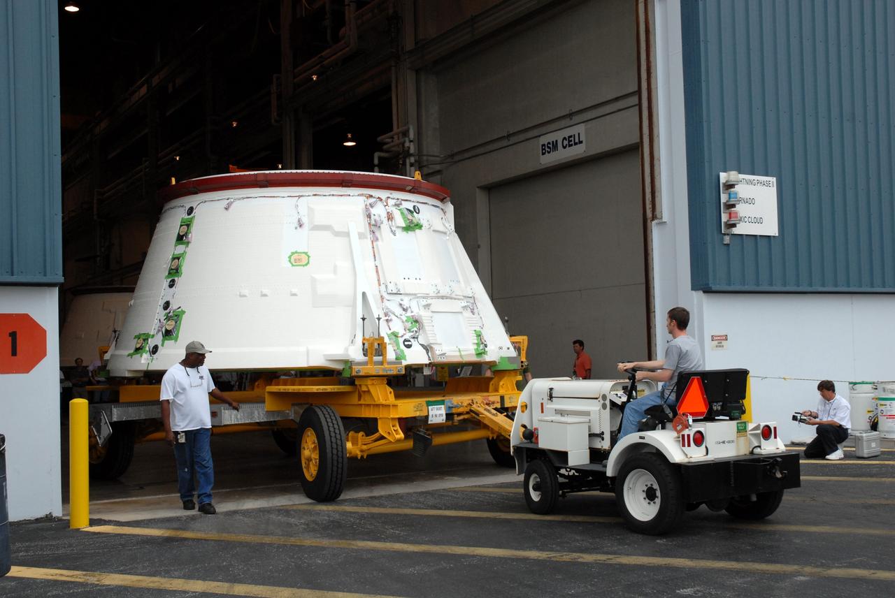 CAPE CANAVERAL, Fla. –  The Ares I-X aft skirt is moved to the aft skirt test facility behind  in the Assembly and Refurbishment Facility at NASA's Kennedy Space Center in Florida. The I-X flight will provide NASA an early opportunity to test and prove hardware, facilities and ground operations associated with Ares I, part of the Constellation Program to return men to the moon and beyond.  Photo credit: NASA/Troy Cryder