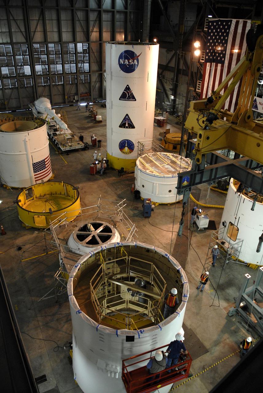 CAPE CANAVERAL, Fla. – In High Bay 4 of the Vehicle Assembly Building at NASA's Kennedy Space Center in Florida, the Ares I-X upper stage simulator service module/service adapter segment (foreground) is being prepared for its move to a stand.  Other segments are placed and stacked on the floor around it.  Ares I-X is the test vehicle for the Ares I, which is part of the Constellation Program to return men to the moon and beyond.  The Ares I-X is targeted for launch in July 2009.  Photo credit: NASA/Kim Shiflett