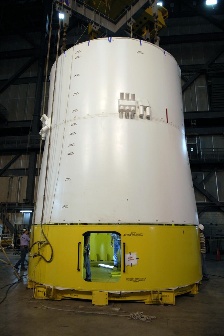 CAPE CANAVERAL, Fla. –  In High Bay 4 of the Vehicle Assembly Building at NASA's Kennedy Space Center in Florida, the Ares I-X upper stage simulator service module/service adapter segment has been installed on a stand. Ares I-X is the test vehicle for the Ares I, which is part of the Constellation Program to return men to the moon and beyond.  The Ares I-X is targeted for launch in July 2009.  Photo credit: NASA/Kim Shiflett