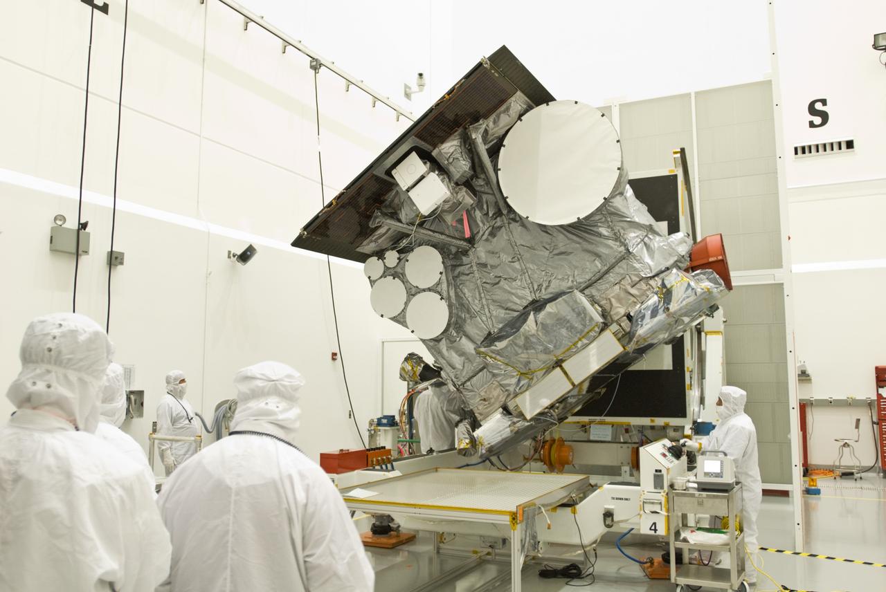 CAPE CANAVERAL, Fla. –  In the Astrotech payload processing facility in Titusville, Fla., the GOES-O satellite is rotated on a stand for blanket inspection.  The latest Geostationary Operational Environmental Satellite, GOES-O was developed by NASA for the National Oceanic and Atmospheric Administration, or NOAA. Once in orbit, GOES-O will be designated GOES-14, and NASA will provide on-orbit checkout and then transfer operational responsibility to NOAA. The GOES-O satellite is targeted to launch April 28 onboard a United Launch Alliance Delta IV expendable launch vehicle.    Photo credit: NASA/Jim Grossmann