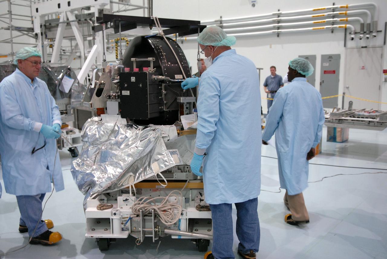 CAPE CANAVERAL, Fla. – In the Space Station Processing Facility at NASA's Kennedy Space Center in Florida,  the control moment gyroscope, or CMG, is placed on the small adapter plate assembly. The CMG is part of the payload on the STS-129 mission to the International Space Station. On the mission, space shuttle Atlantis also will deliver the orbital spares and replacement parts to sustain the life of the station.  Photo credit: NASA/Troy Cryder