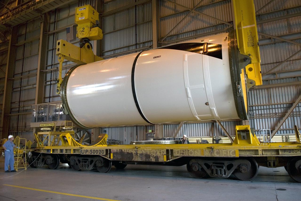 CAPE CANAVERAL, Fla. – In the Rotation, Processing and Surge Facility at NASA's Kennedy Space Center in Florida, cranes attached to the Ares I-X center forward segment lift it off the transporter to raise it to vertical. Once vertical, the segment will be moved to a stand. The booster used for the Ares I-X launch is being modified by adding new forward structures and a fifth segment simulator. The stacking operations are scheduled to begin in the Vehicle Assembly Building in April. Launch of the Ares I-X flight test is targeted for July 2009. Photo credit: NASA/Troy Cryder
