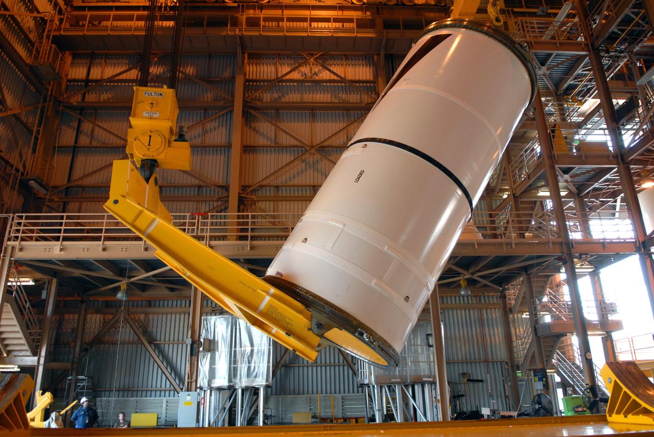 CAPE CANAVERAL, Fla. –  In the Rotation,  Processing and Surge Facility at NASA's Kennedy Space Center in Florida, the Ares I-X center forward segment is being raised to vertical.  The segment will be moved to a stand. The booster used for the Ares I-X launch is being modified by adding new forward structures and a fifth segment simulator. The stacking operations are scheduled to begin in the Vehicle Assembly Building in April. Launch of the Ares I-X flight test is targeted for July 2009. Photo credit: NASA/Troy Cryder