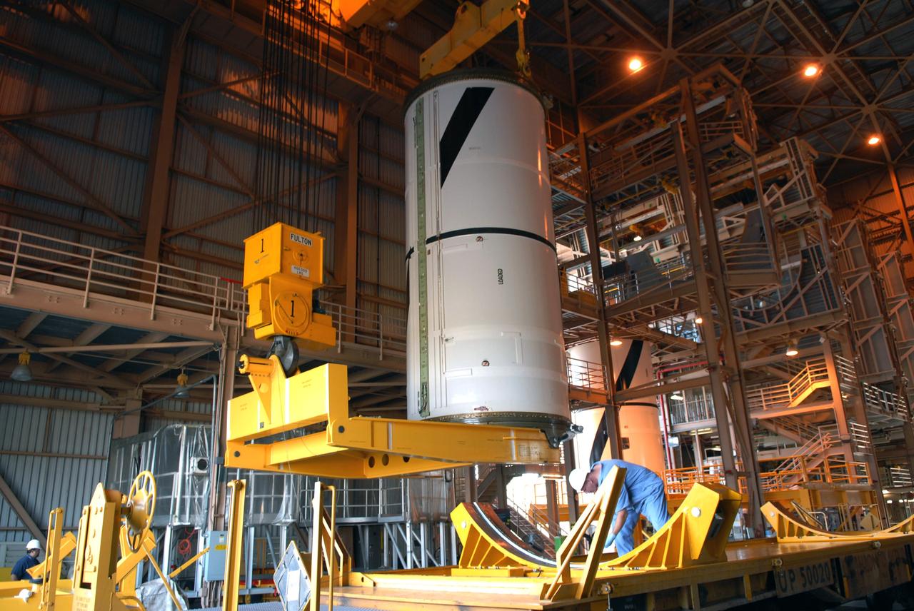CAPE CANAVERAL, Fla. –  In the Rotation,  Processing and Surge Facility at NASA's Kennedy Space Center in Florida, the Ares I-X center forward segment has been raised to vertical.  The segment will be moved to a stand. The booster used for the Ares I-X launch is being modified by adding new forward structures and a fifth segment simulator. The stacking operations are scheduled to begin in the Vehicle Assembly Building in April. Launch of the Ares I-X flight test is targeted for July 2009. Photo credit: NASA/Troy Cryder