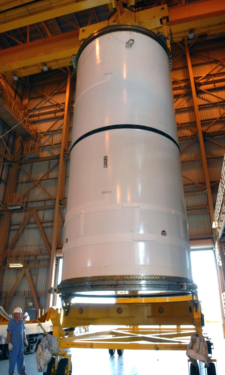 CAPE CANAVERAL, Fla. –  In the Rotation, Processing and Surge Facility at NASA's Kennedy Space Center in Florida, cranes move the Ares I-X center forward segment after its removal from a transporter. The booster used for the Ares I-X launch is being modified by adding new forward structures and a fifth segment simulator. The stacking operations are scheduled to begin in the Vehicle Assembly Building in April. Launch of the Ares I-X flight test is targeted for July 2009. Photo credit: NASA/Troy Cryder