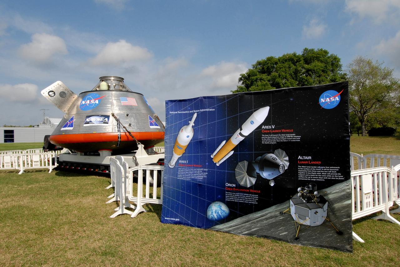 CAPE CANAVERAL, Fla. –  On display at the Kennedy Space Center Visitor Complex in Florida is the Orion crew exploration vehicle mockup (left) and an exhibit about the Constellation Program.  The Orion mockup is on display before heading offshore to be tested in open water.  The spacecraft mock-up traveled from the Naval Surface Warfare Center's Carderock Division in Bethesda, Md. The goal of the open water testing, dubbed the Post-landing Orion Recovery Test, or PORT, is to determine what kind of motion astronauts can expect after landing, as well as outside conditions for recovery teams. Part of the Constellation Program, Orion is targeted to begin carrying humans to the International Space Station in 2015 and to the moon by 2020.   Photo credit: NASA/Jack Pfaller
