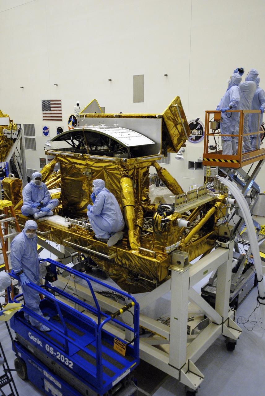 CAPE CANAVERAL, Fla. –  STS-125 crew members conduct equipment and procedure familiarization on parts of the payload in the Payload Hazardous Servicing Facility at NASA's Kennedy Space Center in Florida in preparation for their mission to service NASA's Hubble Space Telescope. Space shuttle Atlantis' 11-day flight is targeted for launch May 12 and will include five spacewalks to refurbish and upgrade the telescope with state-of-the-art science instruments. The payload includes a Wide Field Camera 3, fine guidance sensor and the Cosmic Origins Spectrograph. As a result, Hubble's capabilities will be expanded and its operational lifespan extended through at least 2014.   Photo credit: NASA/Kim Shiflett