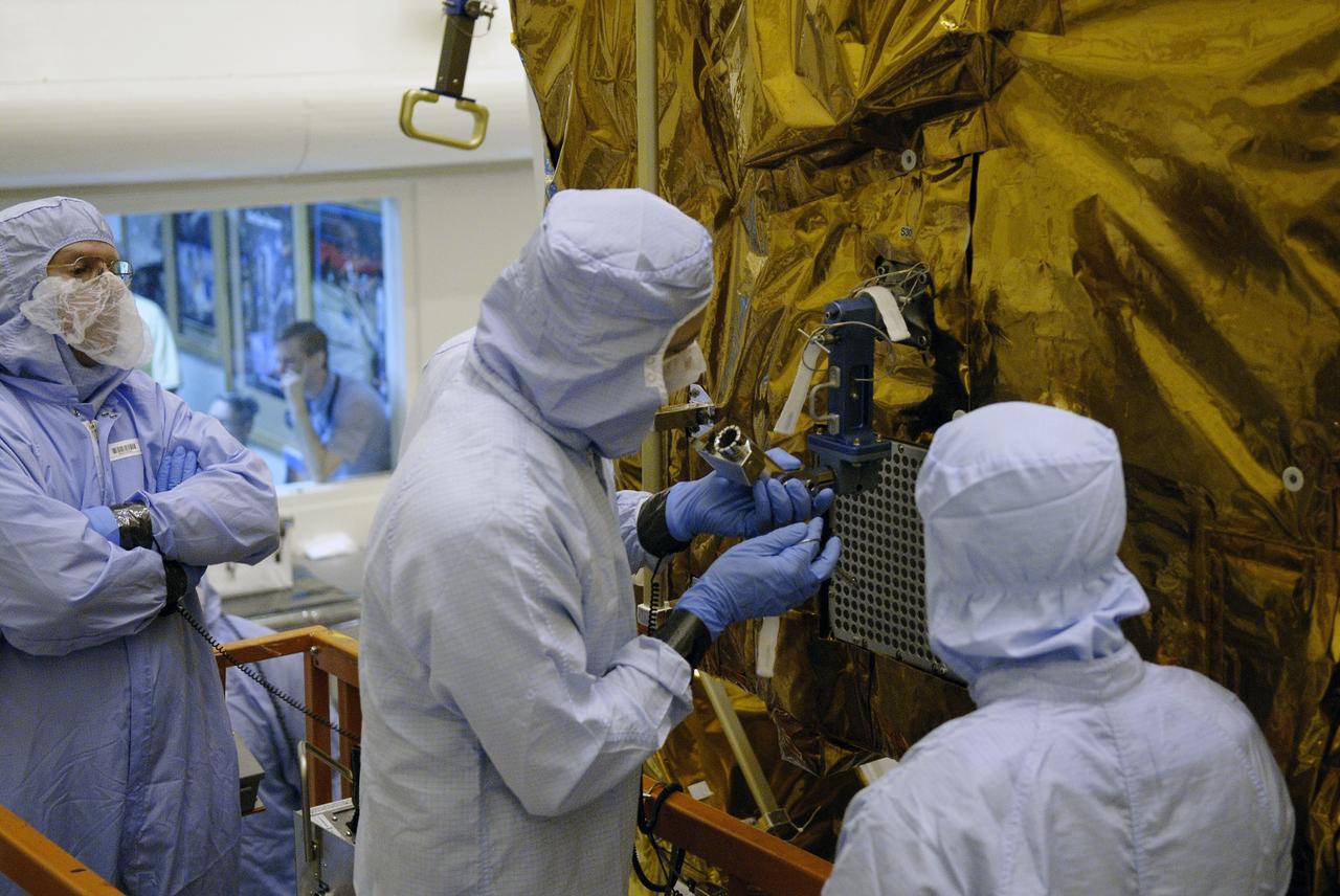 CAPE CANAVERAL, Fla. –  STS-125 crew members conduct equipment and procedure familiarization on parts of the payload in the Payload Hazardous Servicing Facility at NASA's Kennedy Space Center in Florida in preparation for their mission to service NASA's Hubble Space Telescope.  Space shuttle Atlantis' 11-day flight is targeted for launch May 12 and will include five spacewalks to refurbish and upgrade the telescope with state-of-the-art science instruments. The payload includes a Wide Field Camera 3, fine guidance sensor and the Cosmic Origins Spectrograph. As a result, Hubble's capabilities will be expanded and its operational lifespan extended through at least 2014.   Photo credit: NASA/Kim Shiflett