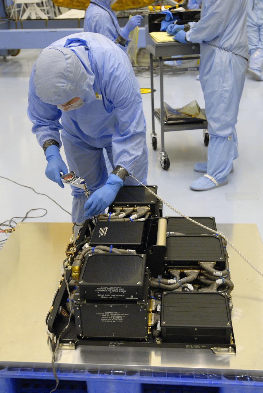 CAPE CANAVERAL, Fla. –  In the Payload Hazardous Servicing Facility at NASA's Kennedy Space Center in Florida, a technician prepares the Science Instrument Command and Data Handling Unit, or SIC&DH, for its move to the Multi-Use Lightweight Equipment Carrier in the facility. The SIC&DH will be installed on the Hubble Space Telescope during space shuttle Atlantis' STS-125 mission. This unit will replace the one that suffered a failure aboard the orbiting telescope on Sept. 27, 2008. Atlantis is targeted for launch on May 12.  Photo credit: NASA/Dimitri Gerondidakis