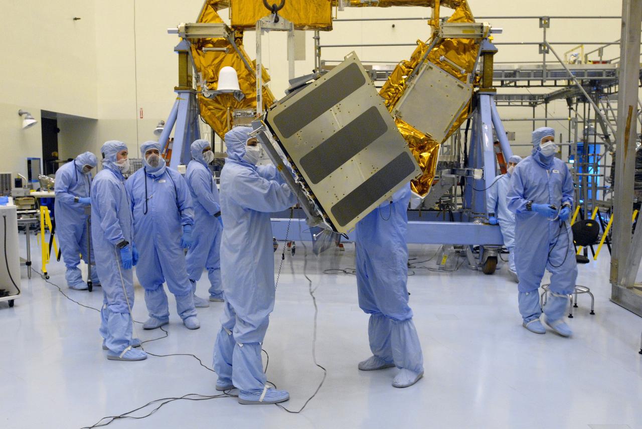 CAPE CANAVERAL, Fla. –  In the Payload Hazardous Servicing Facility at NASA's Kennedy Space Center in Florida, the Science Instrument Command and Data Handling Unit, or SIC&DH, is moved toward the Multi-Use Lightweight Equipment Carrier in the background, where it will be installed. The SIC&DH will be installed on the Hubble Space Telescope during space shuttle Atlantis' STS-125 mission. This unit will replace the one that suffered a failure aboard the orbiting telescope on Sept. 27, 2008. Atlantis is targeted for launch on May 12.  Photo credit: NASA/Dimitri Gerondidakis
