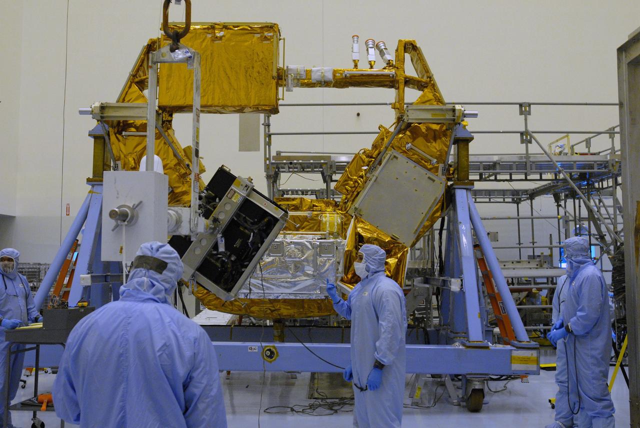 CAPE CANAVERAL, Fla. –  In the Payload Hazardous Servicing Facility at NASA's Kennedy Space Center in Florida, the Science Instrument Command and Data Handling Unit, or SIC&DH, is moved toward the Multi-Use Lightweight Equipment Carrier in the background, where it will be installed.  The SIC&DH will be installed on the Hubble Space Telescope during space shuttle Atlantis' STS-125 mission. This unit will replace the one that suffered a failure aboard the orbiting telescope on Sept. 27, 2008. Atlantis is targeted for launch on May 12.  Photo credit: NASA/Dimitri Gerondidakis