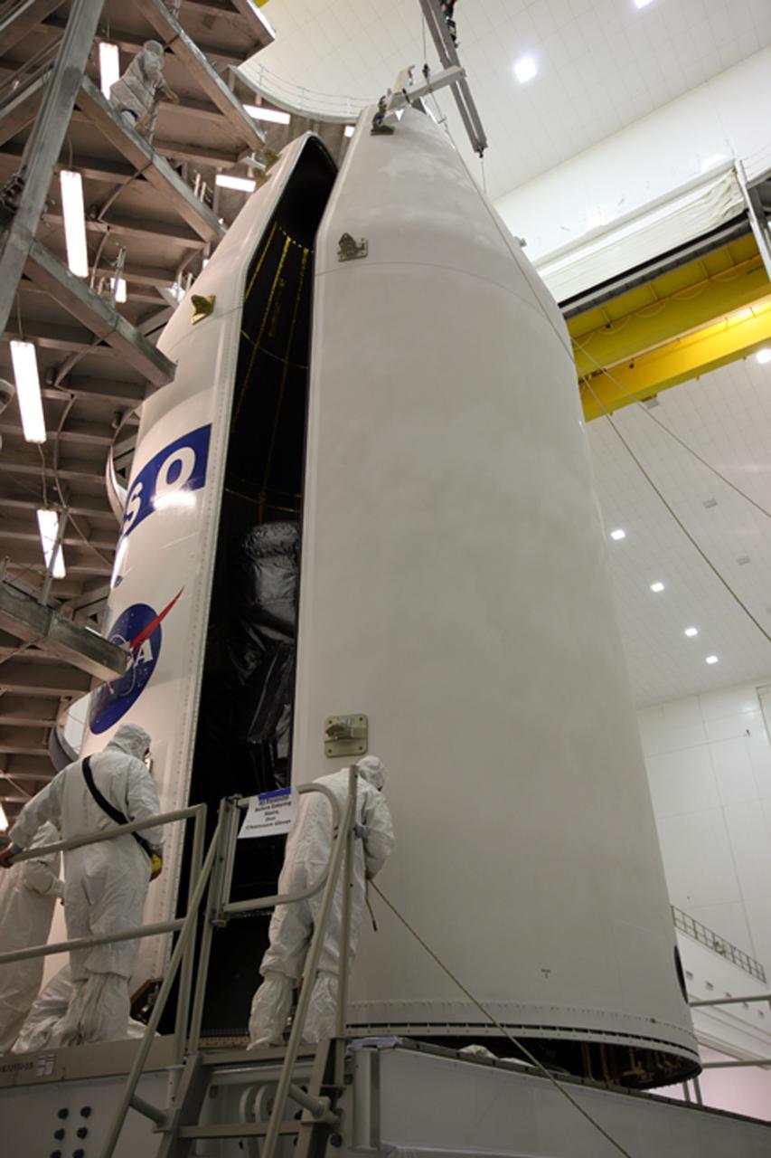 CAPE CANAVERAL, Fla. – In the Astrotech payload processing facility in Titusville, Fla., the two halves of the payload fairing move closer together to encapsulate the GOES-O satellite inside. The fairing is a molded structure that fits flush with the outside surface of the rocket and forms an aerodynamically smooth nose cone, protecting the spacecraft during launch and ascent. The latest Geostationary Operational Environmental Satellite, GOES-O was developed by NASA for the National Oceanic and Atmospheric Administration, or NOAA. The GOES satellites continuously provide observations of 60 percent of the Earth including the continental United States, providing weather monitoring and forecast operations as well as a continuous and reliable stream of environmental information and severe weather warnings. Once in orbit, GOES-O will be designated GOES-14, and NASA will provide on-orbit checkout and then transfer operational responsibility to NOAA. The GOES-O satellite is targeted to launch from Cape Canaveral Air Force Station's Launch Complex 37 on April 28 onboard a United Launch Alliance Delta IV expendable launch vehicle. Photo credit: NASA/Dimitri Gerondidakis