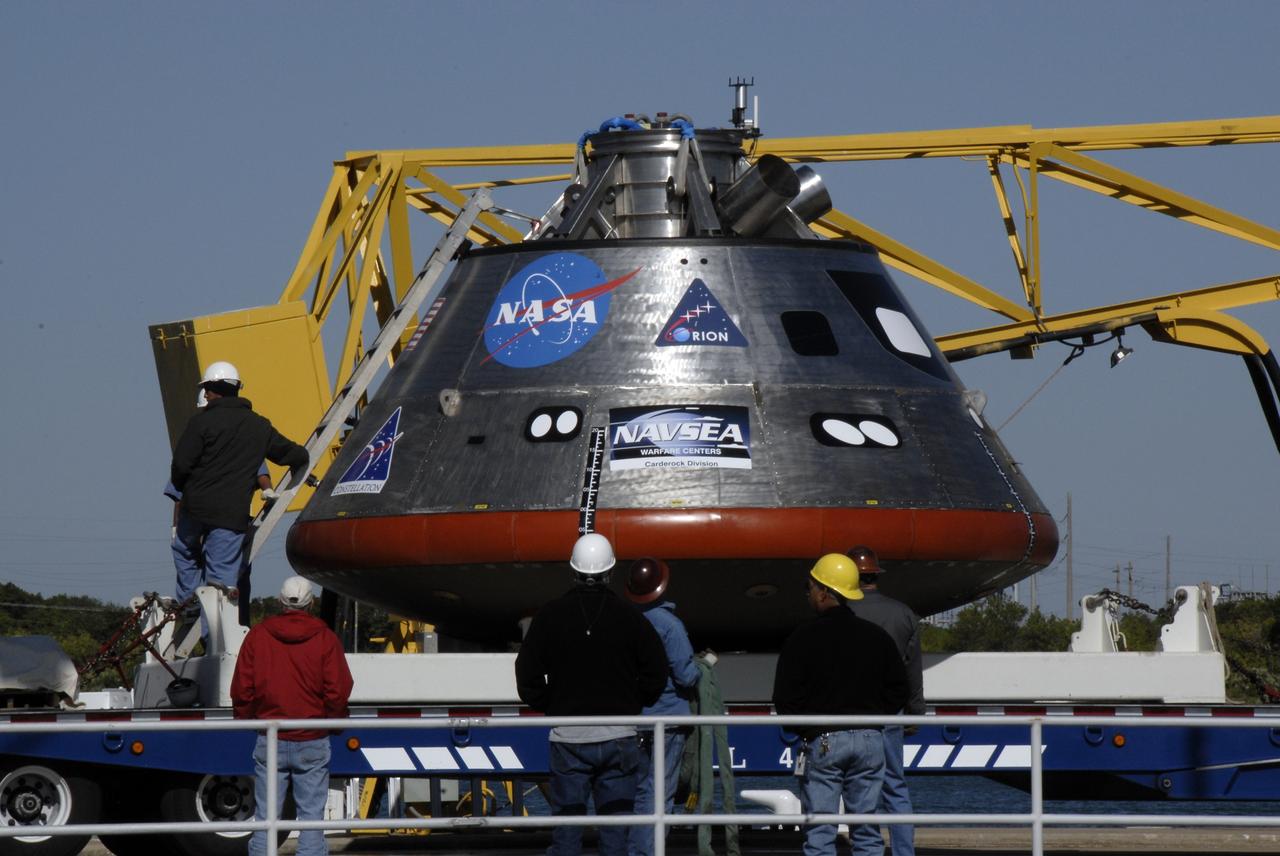 CAPE CANAVERAL, Fla. – The mockup Orion crew exploration vehicle is on the dock at the Trident Basin at Port Canaveral, Fla., waiting to be tested in open water. The goal of the operation, dubbed the Post-landing Orion Recovery Test, or PORT, is to determine what kind of motion astronauts can expect after landing, as well as outside conditions for recovery teams. Orion is targeted to begin carrying humans to the International Space Station in 2015 and to the moon by 2020. Orion, along with the Ares I and V rockets and the Altair lunar lander, are part of the Constellation Program.  Photo credit: NASA/Kim Shiflett