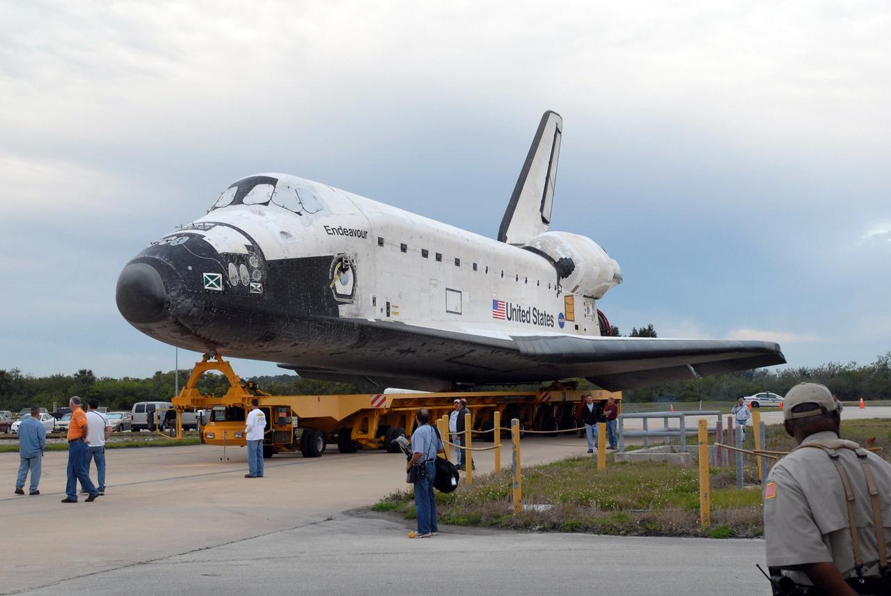 CAPE CANAVERAL, Fla. –  Space shuttle Endeavour is transported from Orbiter Processing Facility 2 to the Vehicle Assembly Building at NASA's Kennedy Space Center, Fla. The first motion of the shuttle out of its hangar was at 6:56 a.m. EDT. In the VAB, Endeavour will be lifted into High Bay 1 and mated to the external fuel tank and solid rocket boosters already installed on the mobile launcher platform. Endeavour is scheduled to roll out to Launch Pad 39B in about a week.  Endeavour will be prepared on the pad for liftoff in the unlikely event that a rescue mission is necessary following space shuttle Atlantis' launch on the STS-125 mission to service the Hubble Space Telescope. After Atlantis is cleared to land, Endeavour will move to Launch Pad 39A for its upcoming STS-127 mission to the International Space Station, targeted to launch in mid-June.   Photo credit: NASA/Jim Grossmann