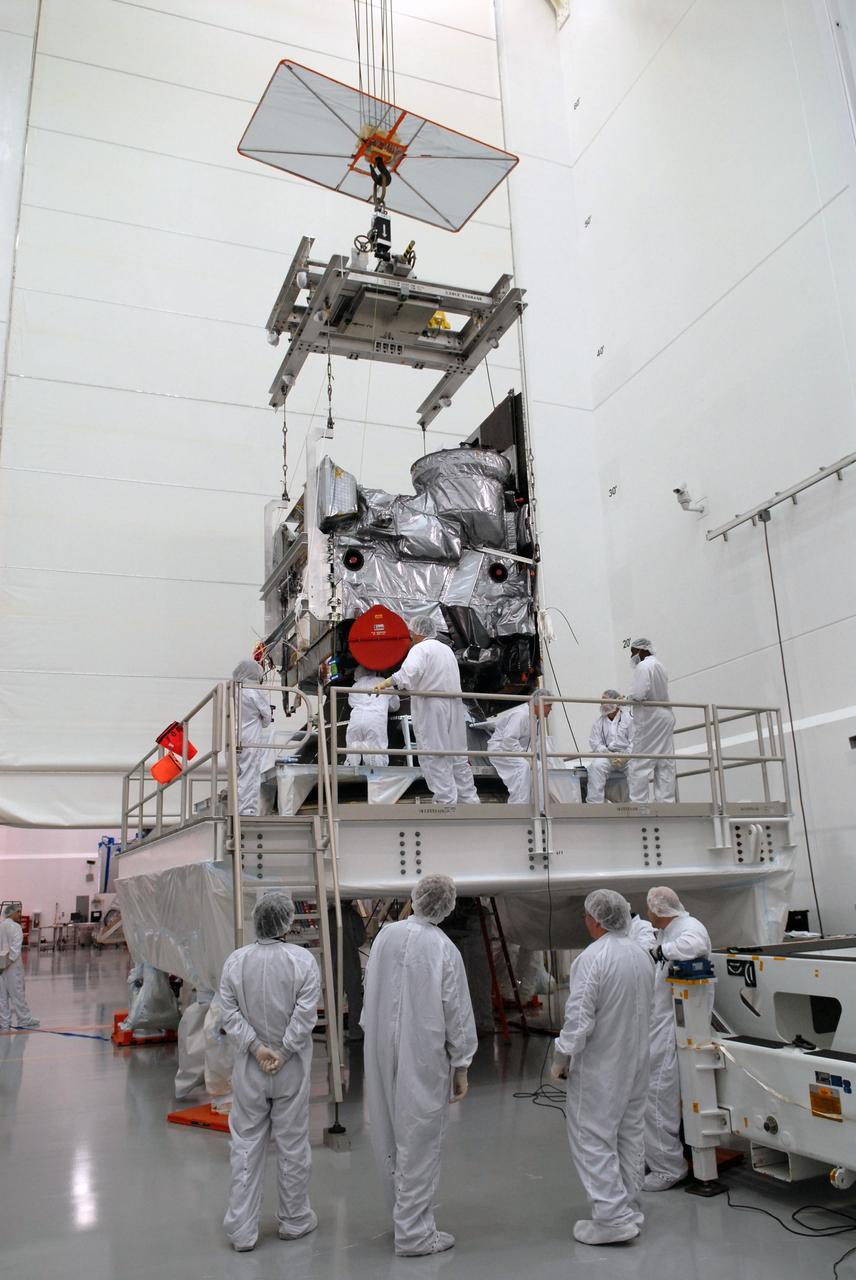 CAPE CANAVERAL, Fla. – In the Astrotech payload processing facility in Titusville, Fla., technicians prepare to move the GOES-O satellite onto a special stand for loading of its oxidizer and hydrazine propellants. The latest Geostationary Operational Environmental Satellite, GOES-O was developed by NASA for the National Oceanic and Atmospheric Administration, or NOAA. The GOES satellites continuously provide observations of 60 percent of the Earth including the continental United States, providing weather monitoring and forecast operations as well as a continuous and reliable stream of environmental information and severe weather warnings. Once in orbit, GOES-O will be designated GOES-14, and NASA will provide on-orbit checkout and then transfer operational responsibility to NOAA. The GOES-O satellite is targeted to launch from Cape Canaveral Air Force Station's Launch Complex 37 no earlier than May 12 onboard a United Launch Alliance Delta IV expendable launch vehicle.  Photo credit: NASA/Troy Cryder