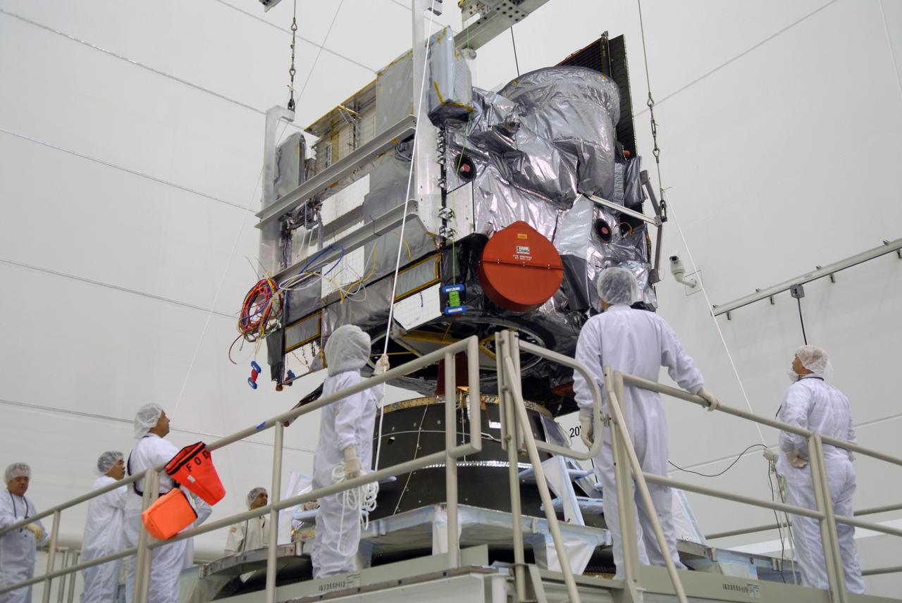 CAPE CANAVERAL, Fla. – In the Astrotech payload processing facility in Titusville, Fla., technicians lift the GOES-O satellite to move it to a special stand for loading of its oxidizer and hydrazine propellants. The latest Geostationary Operational Environmental Satellite, GOES-O was developed by NASA for the National Oceanic and Atmospheric Administration, or NOAA. The GOES satellites continuously provide observations of 60 percent of the Earth including the continental United States, providing weather monitoring and forecast operations as well as a continuous and reliable stream of environmental information and severe weather warnings. Once in orbit, GOES-O will be designated GOES-14, and NASA will provide on-orbit checkout and then transfer operational responsibility to NOAA. The GOES-O satellite is targeted to launch from Cape Canaveral Air Force Station's Launch Complex 37 no earlier than May 12 onboard a United Launch Alliance Delta IV expendable launch vehicle.  Photo credit: NASA/Troy Cryder