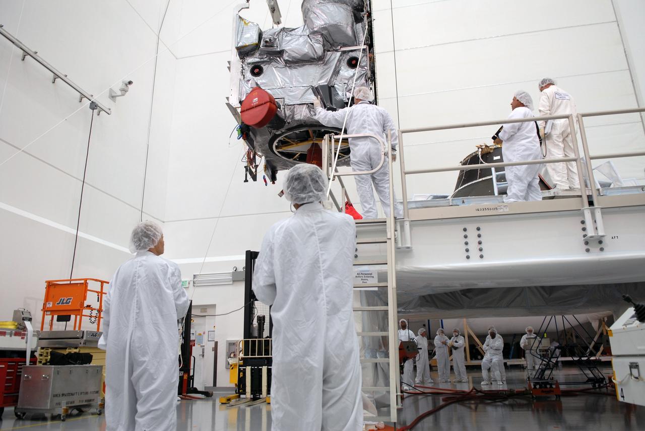 CAPE CANAVERAL, Fla. – In the Astrotech payload processing facility in Titusville, Fla., technicians monitor the lift of the GOES-O satellite toward a special stand for loading of its oxidizer and hydrazine propellants. The latest Geostationary Operational Environmental Satellite, GOES-O was developed by NASA for the National Oceanic and Atmospheric Administration, or NOAA. The GOES satellites continuously provide observations of 60 percent of the Earth including the continental United States, providing weather monitoring and forecast operations as well as a continuous and reliable stream of environmental information and severe weather warnings. Once in orbit, GOES-O will be designated GOES-14, and NASA will provide on-orbit checkout and then transfer operational responsibility to NOAA. The GOES-O satellite is targeted to launch from Cape Canaveral Air Force Station's Launch Complex 37 no earlier than May 12 onboard a United Launch Alliance Delta IV expendable launch vehicle.  Photo credit: NASA/Troy Cryder