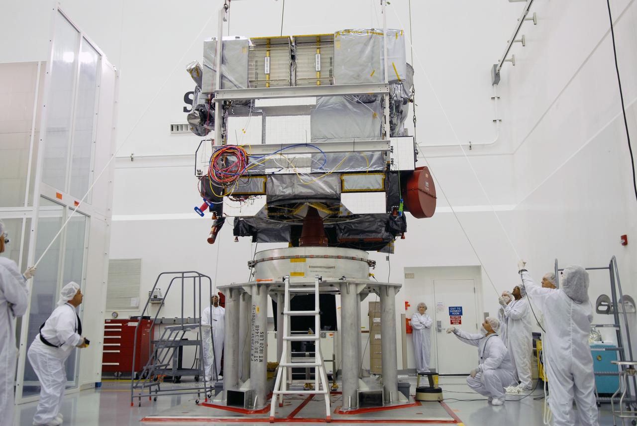 CAPE CANAVERAL, Fla. – In the Astrotech payload processing facility in Titusville, Fla., the GOES-O satellite is gently lowered onto a special stand for loading of its oxidizer and hydrazine propellants. The latest Geostationary Operational Environmental Satellite, GOES-O was developed by NASA for the National Oceanic and Atmospheric Administration, or NOAA. The GOES satellites continuously provide observations of 60 percent of the Earth including the continental United States, providing weather monitoring and forecast operations as well as a continuous and reliable stream of environmental information and severe weather warnings. Once in orbit, GOES-O will be designated GOES-14, and NASA will provide on-orbit checkout and then transfer operational responsibility to NOAA. The GOES-O satellite is targeted to launch from Cape Canaveral Air Force Station's Launch Complex 37 no earlier than May 12 onboard a United Launch Alliance Delta IV expendable launch vehicle.  Photo credit: NASA/Troy Cryder