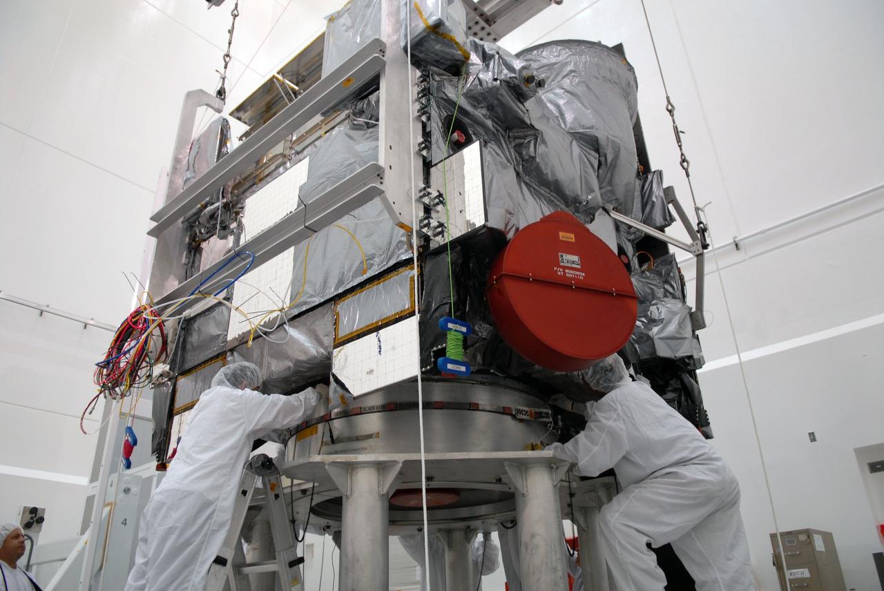CAPE CANAVERAL, Fla. – In the Astrotech payload processing facility in Titusville, Fla., technicians secure the GOES-O satellite onto a special stand for loading of its oxidizer and hydrazine propellants. The latest Geostationary Operational Environmental Satellite, GOES-O was developed by NASA for the National Oceanic and Atmospheric Administration, or NOAA. The GOES satellites continuously provide observations of 60 percent of the Earth including the continental United States, providing weather monitoring and forecast operations as well as a continuous and reliable stream of environmental information and severe weather warnings. Once in orbit, GOES-O will be designated GOES-14, and NASA will provide on-orbit checkout and then transfer operational responsibility to NOAA. The GOES-O satellite is targeted to launch from Cape Canaveral Air Force Station's Launch Complex 37 no earlier than May 12 onboard a United Launch Alliance Delta IV expendable launch vehicle.  Photo credit: NASA/Troy Cryder