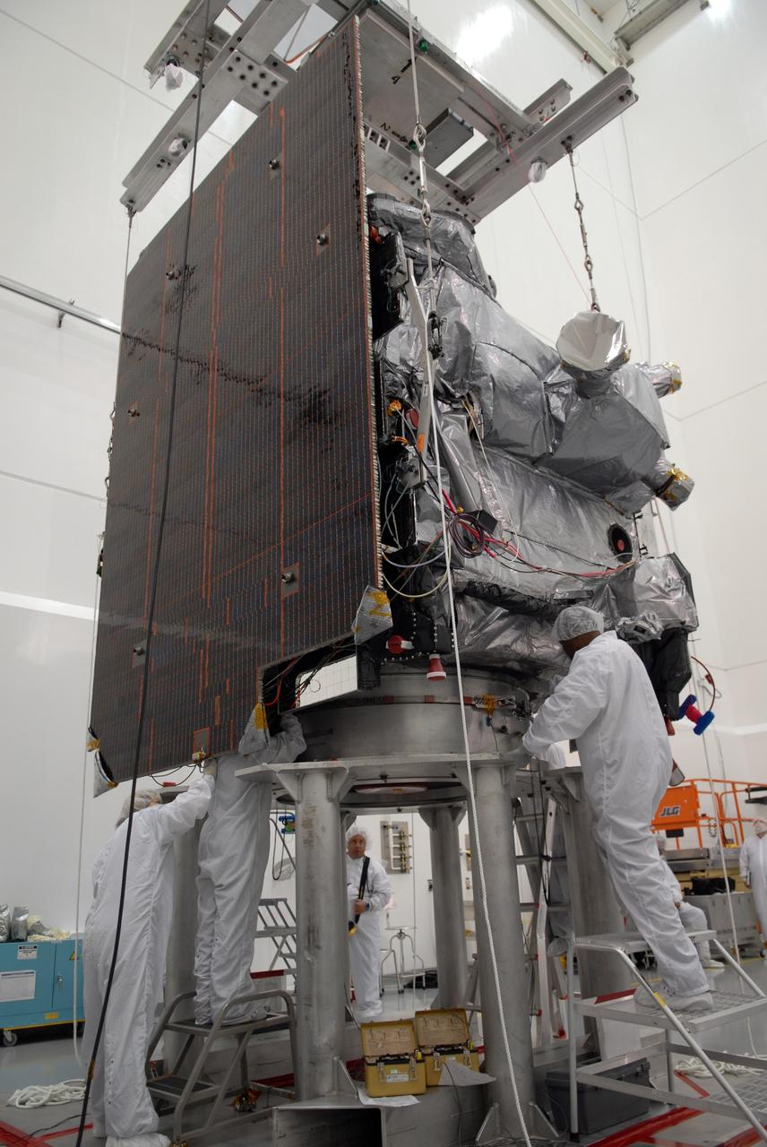 CAPE CANAVERAL, Fla. – In the Astrotech payload processing facility in Titusville, Fla., technicians secure the GOES-O satellite onto a special stand for loading of its oxidizer and hydrazine propellants. The latest Geostationary Operational Environmental Satellite, GOES-O was developed by NASA for the National Oceanic and Atmospheric Administration, or NOAA. The GOES satellites continuously provide observations of 60 percent of the Earth including the continental United States, providing weather monitoring and forecast operations as well as a continuous and reliable stream of environmental information and severe weather warnings. Once in orbit, GOES-O will be designated GOES-14, and NASA will provide on-orbit checkout and then transfer operational responsibility to NOAA. The GOES-O satellite is targeted to launch from Cape Canaveral Air Force Station's Launch Complex 37 no earlier than May 12 onboard a United Launch Alliance Delta IV expendable launch vehicle.  Photo credit: NASA/Troy Cryder