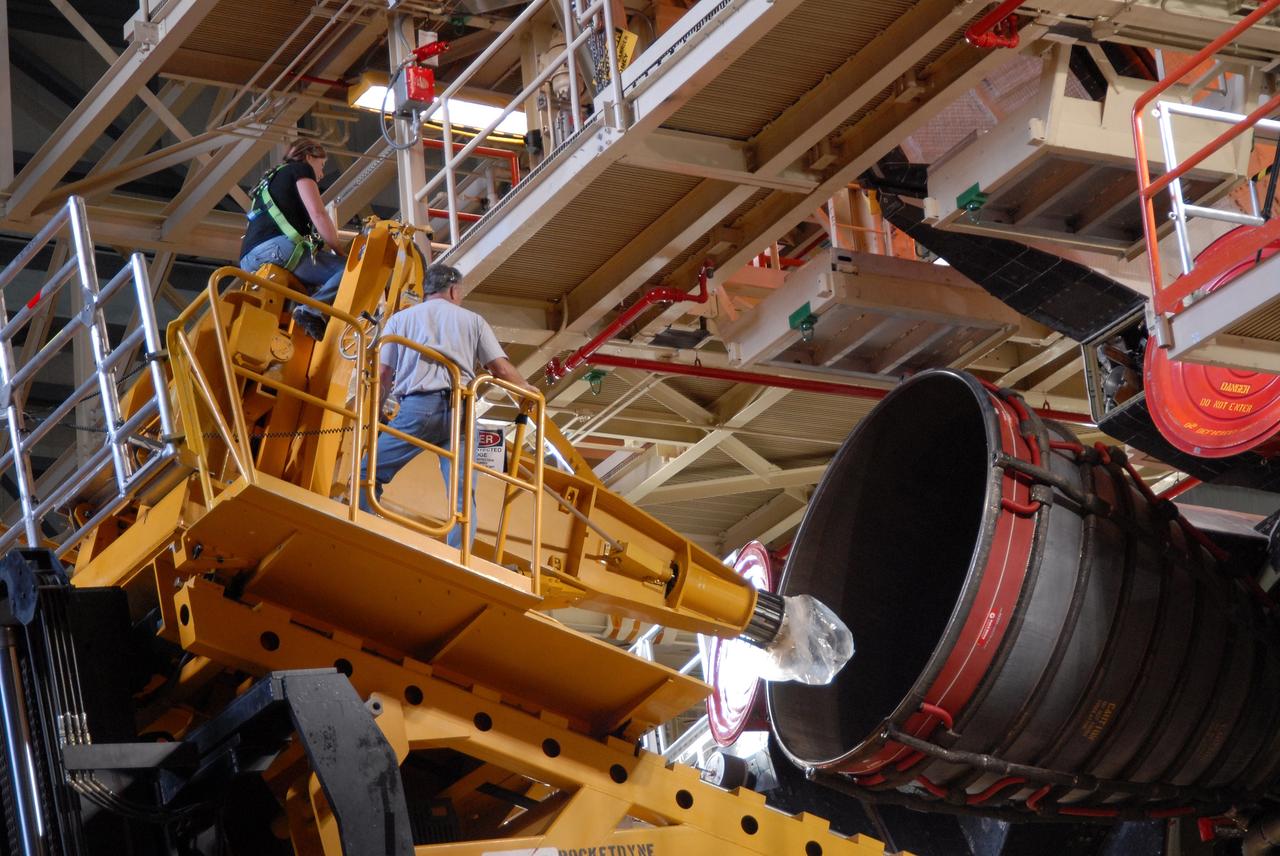 CAPE CANAVERAL, Fla. – At NASA's Kennedy Space Center in Florida, technicians use a Hyster forklift to close in on one of the three main engines on space shuttle Discovery to remove it.  Engine removal is part of the post-landing processing.  Discovery completed the STS-119 mission March 28 with a landing at Kennedy's Shuttle Landing Facility. Each engine is 14 feet long, weighs about 6,700 pounds, and is 7.5 feet in diameter at the end of the nozzle. Discovery next will be used on the STS-128 mission to deliver supplies and equipment to the International Space Station.  The launch is targeted for Aug. 6.  Photo credit: NASA/Tim Jacobs