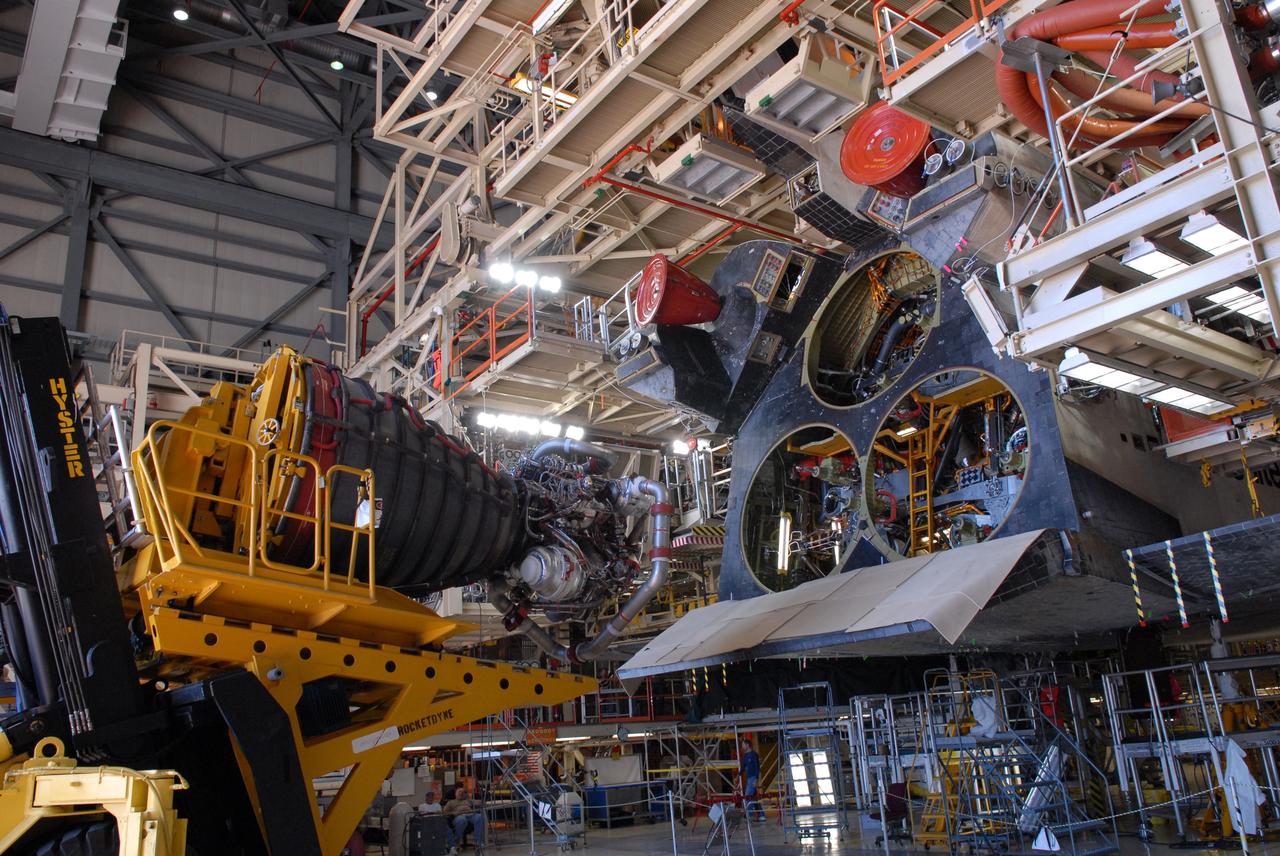 CAPE CANAVERAL, Fla. – At NASA's Kennedy Space Center in Florida, the third and final main engine has been removed from space shuttle Discovery.  Engine removal is part of the post-landing processing.  Discovery completed the STS-119 mission March 28 with a landing at Kennedy's Shuttle Landing Facility.  Each engine is 14 feet long, weighs about 6,700 pounds, and is 7.5 feet in diameter at the end of the nozzle. Discovery next will be used on the STS-128 mission to deliver supplies and equipment to the International Space Station.  The launch is targeted for Aug. 6.  Photo credit: NASA/Tim Jacobs