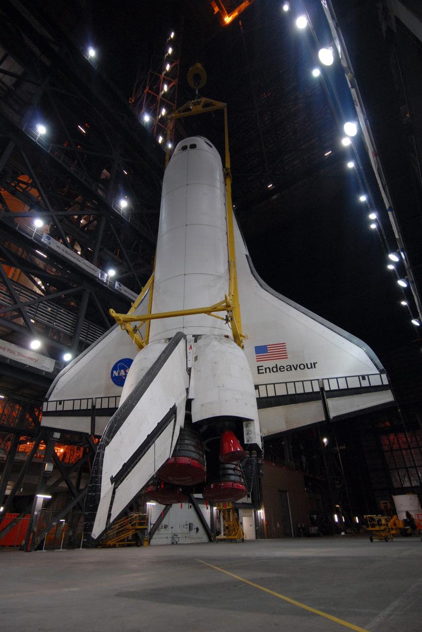 CAPE CANAVERAL, Fla. – Space shuttle Endeavour is suspended above the transfer aisle of the Vehicle Assembly Building at NASA's Kennedy Space Center in Florida. In this position, it is ready to be lifted into High Bay 1 and attached to the external fuel tank and solid rocket boosters already installed on the mobile launcher platform. Endeavour is scheduled to roll out to Launch Pad 39B on April 17. Endeavour will be prepared on the pad for liftoff in the unlikely event that a rescue mission is necessary following space shuttle Atlantis' launch on the STS-125 mission to service the Hubble Space Telescope. After Atlantis is cleared to land, Endeavour will move to Launch Pad 39A for its upcoming STS-127 mission to the International Space Station, targeted to launch in mid-June. Photo credit: NASA/Troy Cryder