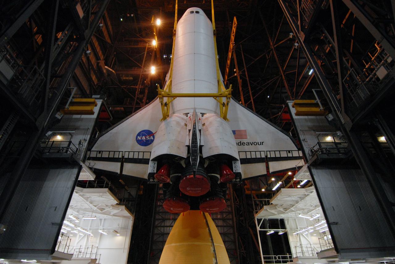 CAPE CANAVERAL, Fla. – In the Vehicle Assembly Building at NASA's Kennedy Space Center in Florida, space shuttle Endeavour is lowered into High Bay 1 toward the external tank and solid rocket boosters already installed on the mobile launcher platform. Endeavour is scheduled to roll out to Launch Pad 39B on April 17. Endeavour will be prepared on the pad for liftoff in the unlikely event that a rescue mission is necessary following space shuttle Atlantis' launch on the STS-125 mission to service the Hubble Space Telescope. After Atlantis is cleared to land, Endeavour will move to Launch Pad 39A for its upcoming STS-127 mission to the International Space Station, targeted to launch in mid-June. Photo credit: NASA/Troy Cryder