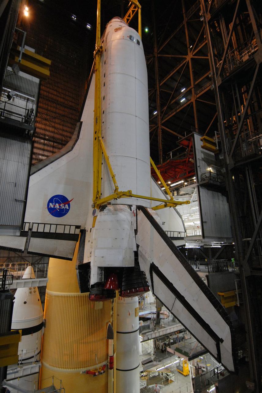 CAPE CANAVERAL, Fla. – In the Vehicle Assembly Building at NASA's Kennedy Space Center in Florida, space shuttle Endeavour is lowered into High Bay 1 toward the mobile launcher platform for attachment to the external tank and solid rocket boosters already installed on the platform. Endeavour is scheduled to roll out to Launch Pad 39B on April 17. Endeavour will be prepared on the pad for liftoff in the unlikely event that a rescue mission is necessary following space shuttle Atlantis' launch on the STS-125 mission to service the Hubble Space Telescope. After Atlantis is cleared to land, Endeavour will move to Launch Pad 39A for its upcoming STS-127 mission to the International Space Station, targeted to launch in mid-June. Photo credit: NASA/Troy Cryder