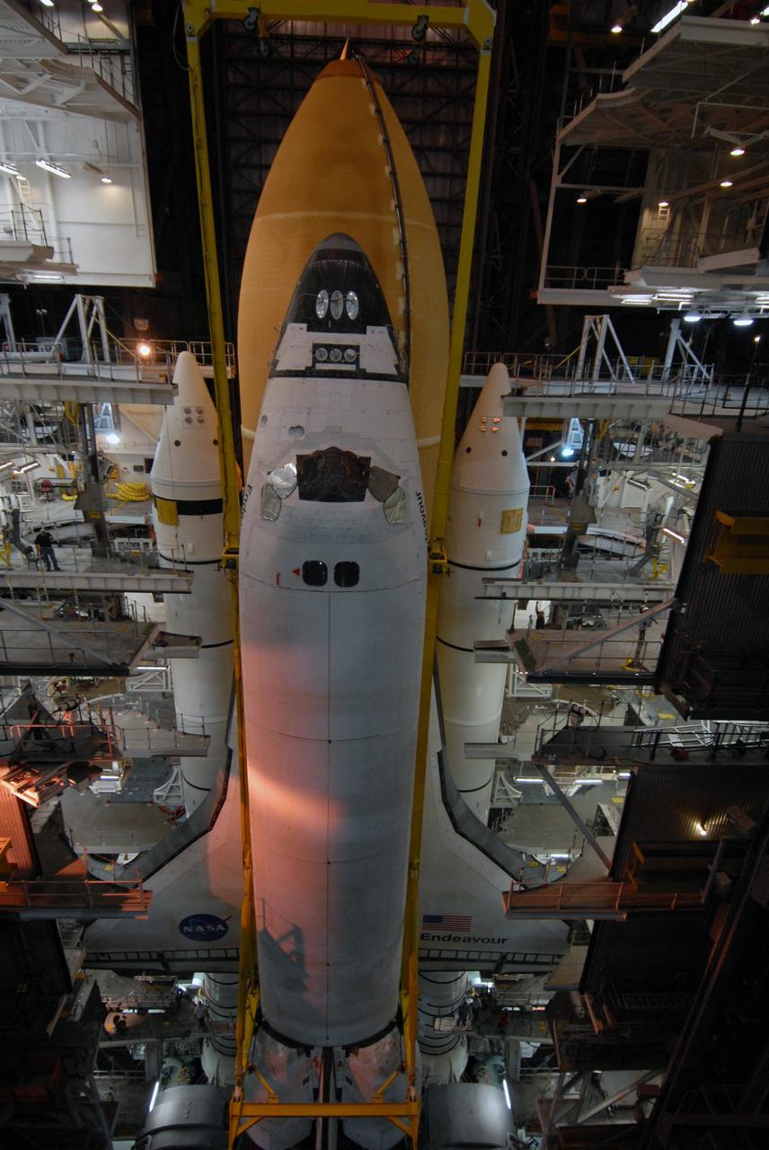 CAPE CANAVERAL, Fla. – In the Vehicle Assembly Building at NASA's Kennedy Space Center in Florida, space shuttle Endeavour is lowered into High Bay 1 toward the mobile launcher platform for attachment to the external tank and solid rocket boosters already installed on the platform. Endeavour is scheduled to roll out to Launch Pad 39B on April 17. Endeavour will be prepared on the pad for liftoff in the unlikely event that a rescue mission is necessary following space shuttle Atlantis' launch on the STS-125 mission to service the Hubble Space Telescope. After Atlantis is cleared to land, Endeavour will move to Launch Pad 39A for its upcoming STS-127 mission to the International Space Station, targeted to launch in mid-June. Photo credit: NASA/Troy Cryder
