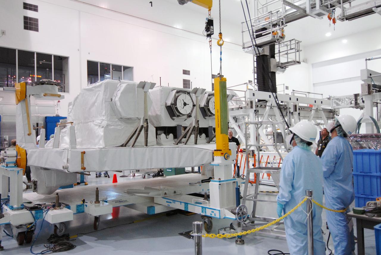 CAPE CANAVERAL, Fla. – In the Space Station Processing Facility at NASA's Kennedy Space Center in Florida,  an overhead crane lifts the Kibo Experiment Logistics Module Exposed Section, or ELM-ES.  The ELM-ES will be moved to a workstand. The ELM-ES is one of the final components of the Japan Aerospace Exploration Agency's Kibo laboratory for the International Space Station.  It can provide payload storage space and can carry up to three payloads at launch. The ELM-ES will be carried aboard space shuttle Endeavour on the STS-127 mission targeted for launch June 13.  Photo credit: NASA/Jack Pfaller