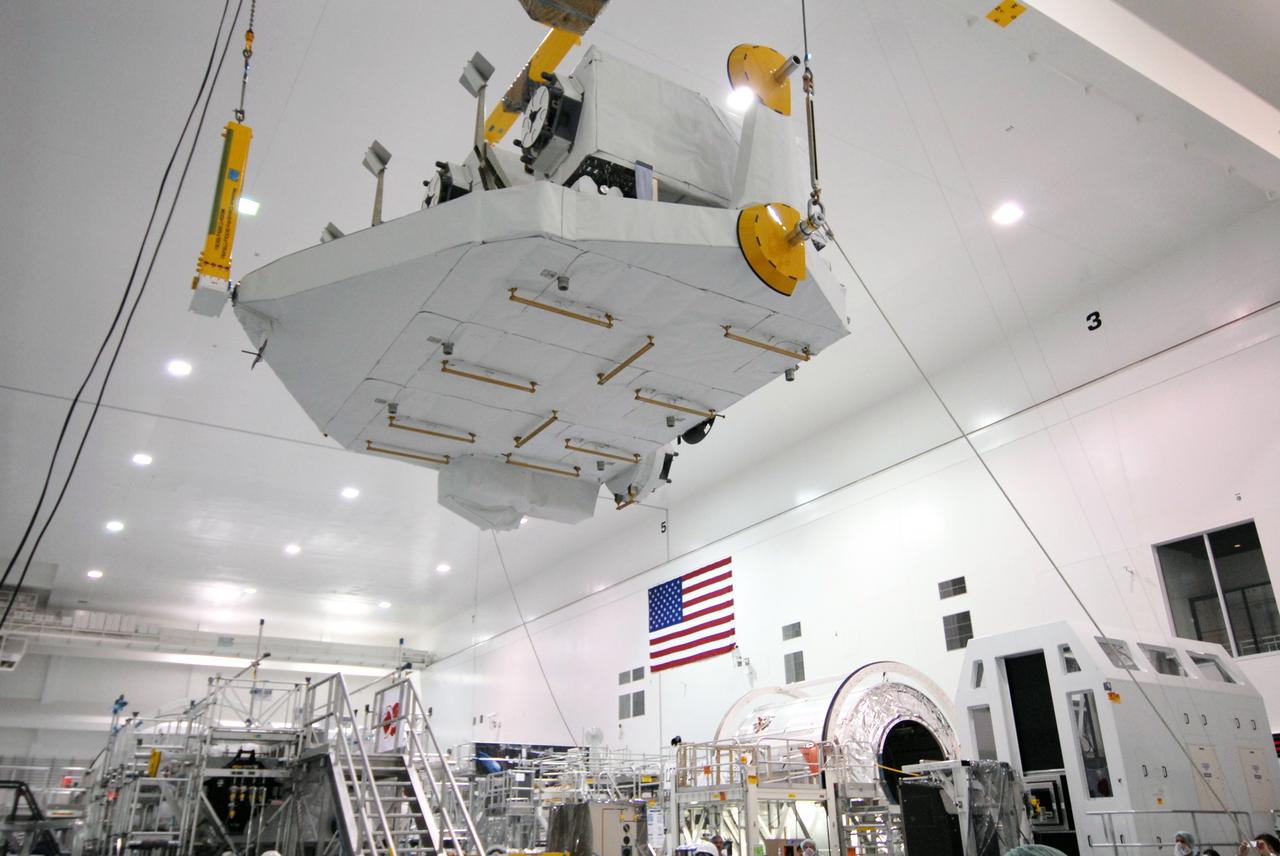 CAPE CANAVERAL, Fla. – In the Space Station Processing Facility at NASA's Kennedy Space Center in Florida, the Kibo Experiment Logistics Module Exposed Section, or ELM-ES, is carried high above the floor as it is moved to a workstand. The ELM-ES is one of the final components of the Japan Aerospace Exploration Agency's Kibo laboratory for the International Space Station.  It can provide payload storage space and can carry up to three payloads at launch. The ELM-ES will be carried aboard space shuttle Endeavour on the STS-127 mission targeted for launch June 13.  Photo credit: NASA/Jack Pfaller