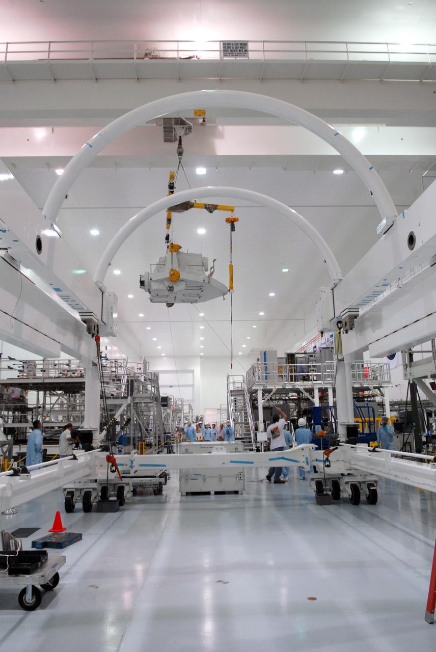 CAPE CANAVERAL, Fla. – In the Space Station Processing Facility at NASA's Kennedy Space Center in Florida, the Kibo Experiment Logistics Module Exposed Section, or ELM-ES, is carried high above the floor as it is moved to a workstand. The ELM-ES is one of the final components of the Japan Aerospace Exploration Agency's Kibo laboratory for the International Space Station.  It can provide payload storage space and can carry up to three payloads at launch. The ELM-ES will be carried aboard space shuttle Endeavour on the STS-127 mission targeted for launch June 13.  Photo credit: NASA/Jack Pfaller