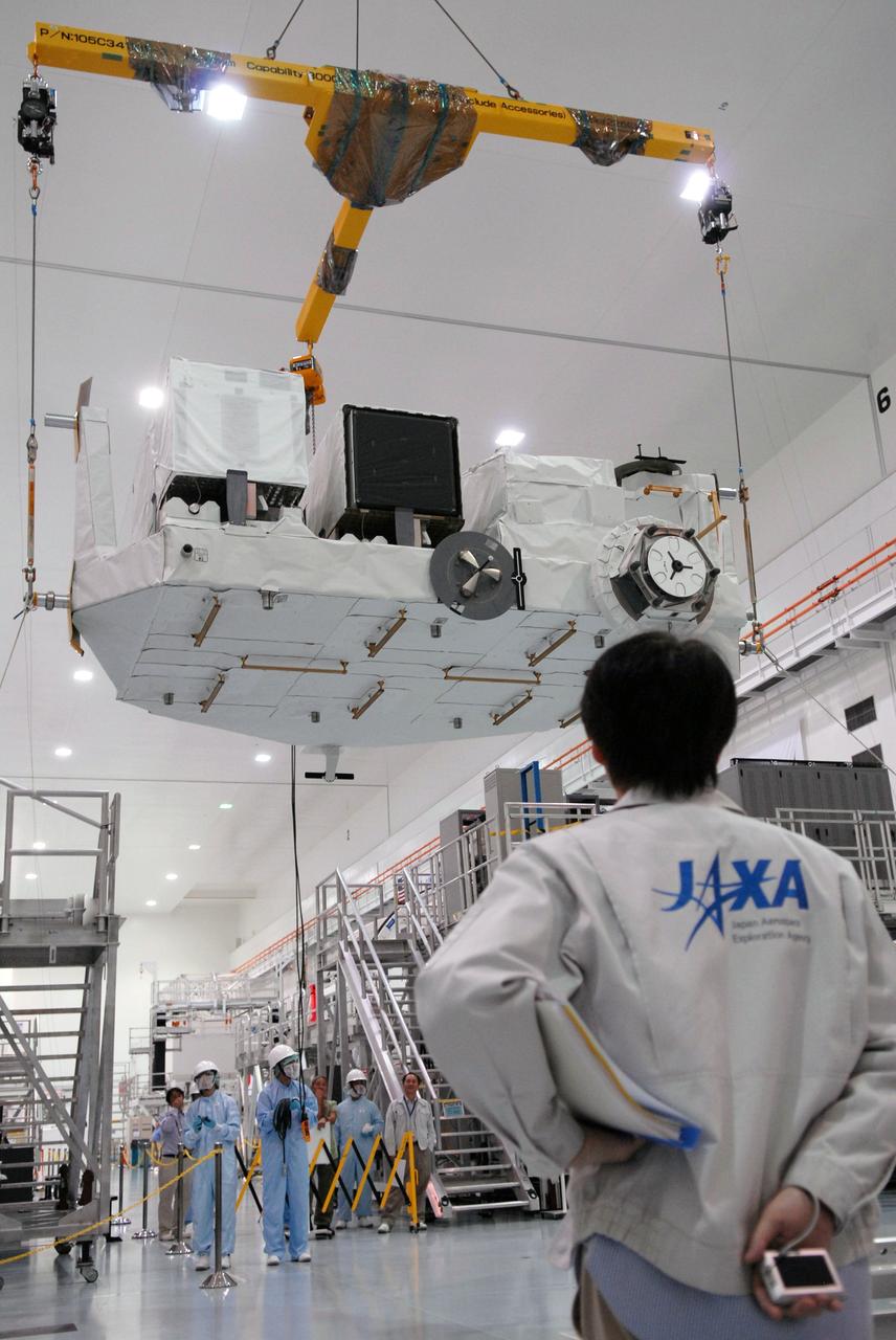 CAPE CANAVERAL, Fla. – In the Space Station Processing Facility at NASA's Kennedy Space Center in Florida, the Kibo Experiment Logistics Module Exposed Section, or ELM-ES, is suspended above the floor before being rotated.  The ELM-ES is being moved to a workstand.  The ELM-ES is one of the final components of the Japan Aerospace Exploration Agency's Kibo laboratory for the International Space Station.  It can provide payload storage space and can carry up to three payloads at launch. The ELM-ES will be carried aboard space shuttle Endeavour on the STS-127 mission targeted for launch June 13.  Photo credit: NASA/Jack Pfaller
