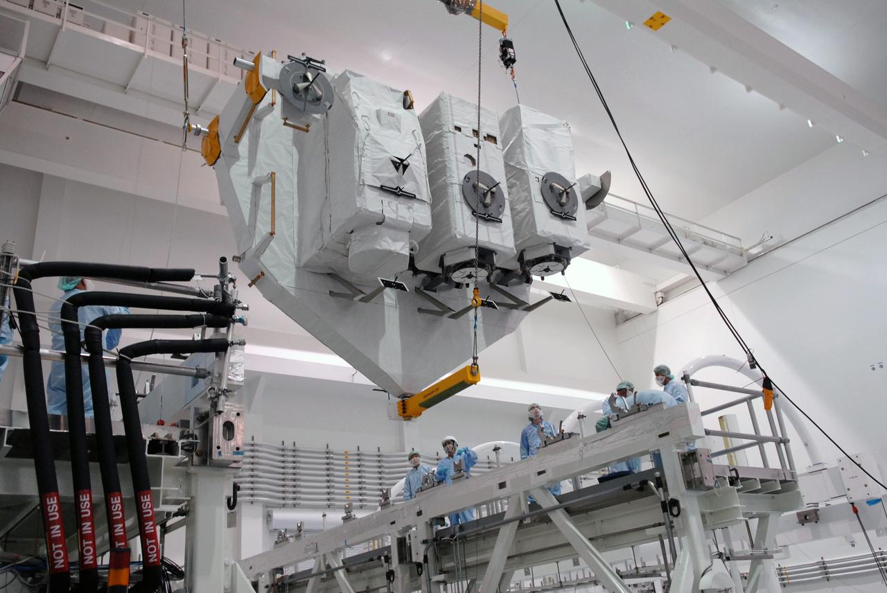 CAPE CANAVERAL, Fla. – In the Space Station Processing Facility at NASA's Kennedy Space Center in Florida, the now vertical Kibo Experiment Logistics Module Exposed Section, or ELM-ES, is moved toward the workstand. The ELM-ES is one of the final components of the Japan Aerospace Exploration Agency's Kibo laboratory for the International Space Station.  It can provide payload storage space and can carry up to three payloads at launch. The ELM-ES will be carried aboard space shuttle Endeavour on the STS-127 mission targeted for launch June 13.  Photo credit: NASA/Jack Pfaller