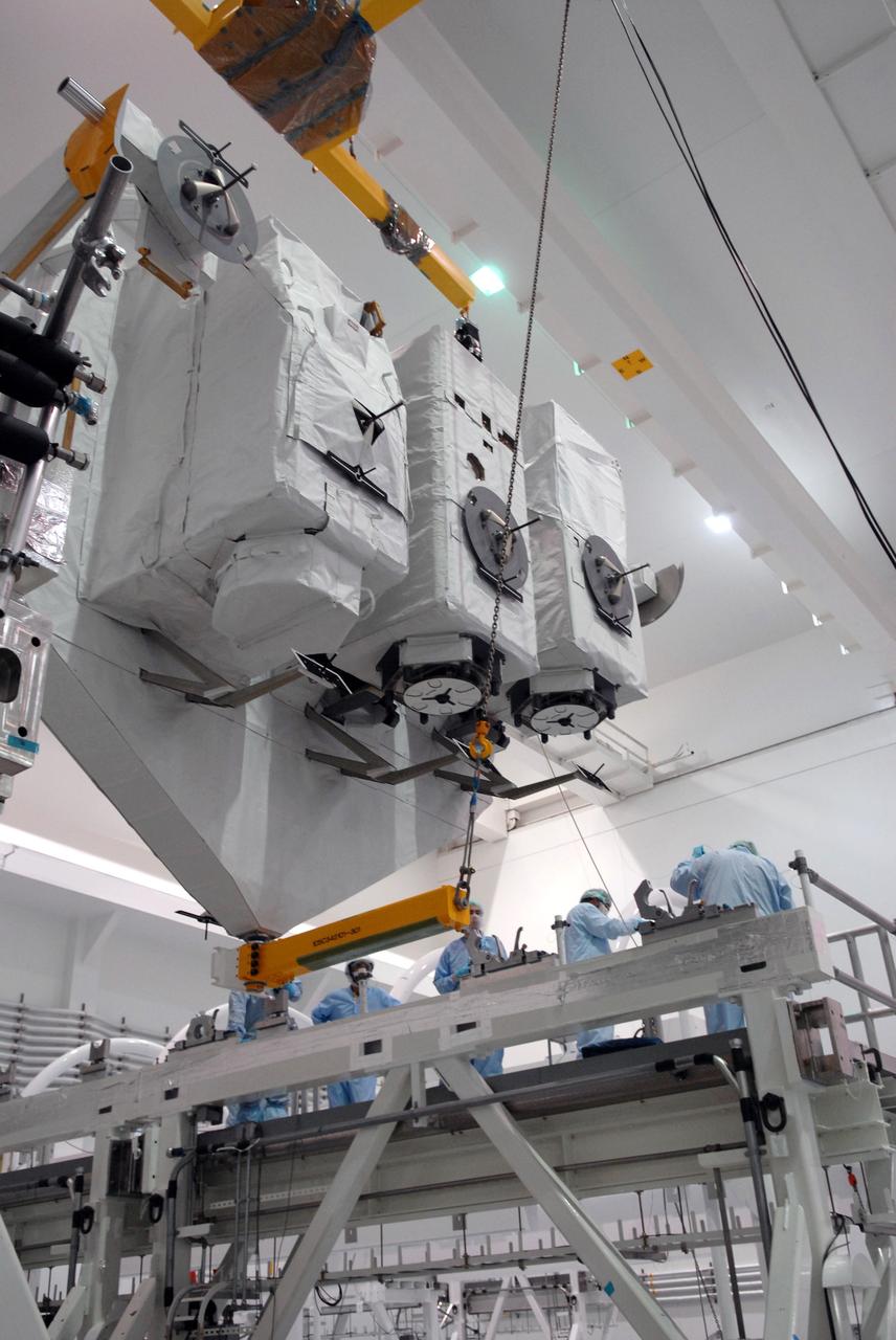 CAPE CANAVERAL, Fla. – In the Space Station Processing Facility at NASA's Kennedy Space Center in Florida, the vertical Kibo Experiment Logistics Module Exposed Section, or ELM-ES, is lowered onto the workstand. The ELM-ES is one of the final components of the Japan Aerospace Exploration Agency's Kibo laboratory for the International Space Station.  It can provide payload storage space and can carry up to three payloads at launch. The ELM-ES will be carried aboard space shuttle Endeavour on the STS-127 mission targeted for launch June 13.  Photo credit: NASA/Jack Pfaller