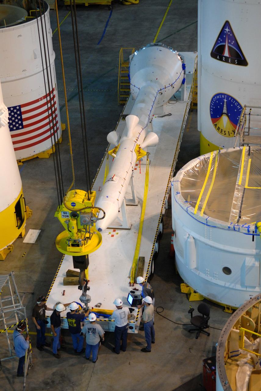 CAPE CANAVERAL, Fla. – In high bay 4 of the Vehicle Assembly Building at NASA's Kennedy Space Center in Florida, workers prepare the crane that will lift and rotate the Ares I-X simulated launch abort system (center) for assembly with the crew module simulator.  Ares I-X is the flight test vehicle for the Ares I, which is part of the Constellation Program to return men to the moon and beyond. Ares I is the essential core of a safe, reliable, cost-effective space transportation system that eventually will carry crewed missions back to the moon, on to Mars and out into the solar system. Ares I-X is targeted for launch in July 2009. Photo credit: NASA/Jack Pfaller