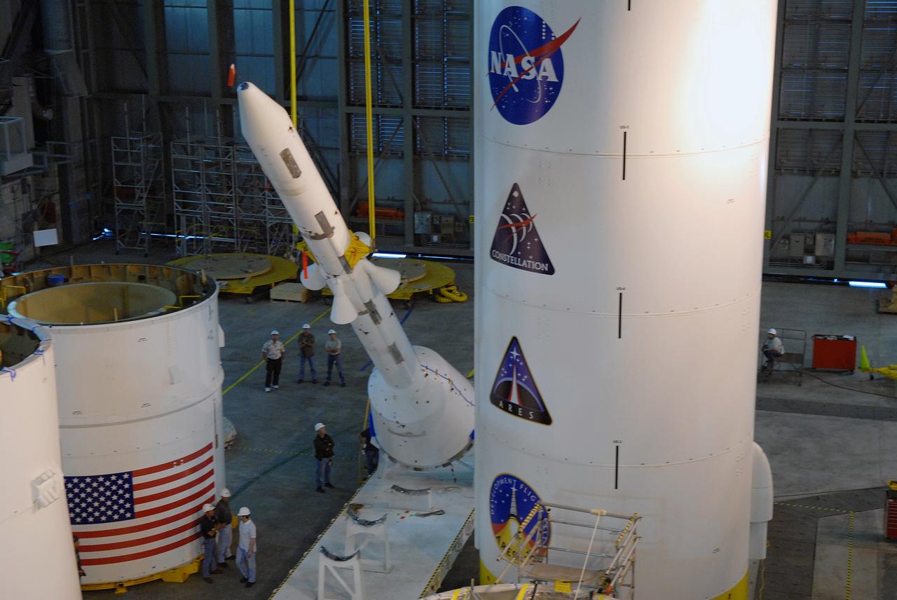 CAPE CANAVERAL, Fla. – In high bay 4 of the Vehicle Assembly Building at NASA's Kennedy Space Center in Florida, the crane raises the Ares I-X simulated launch abort system, or LAS, to a vertical position.  The LAS will then be ready for assembly with the crew module simulator. Ares I-X is the flight test vehicle for the Ares I, which is part of the Constellation Program to return men to the moon and beyond. Ares I is the essential core of a safe, reliable, cost-effective space transportation system that eventually will carry crewed missions back to the moon, on to Mars and out into the solar system. Ares I-X is targeted for launch in July 2009. Photo credit: NASA/Jack Pfaller