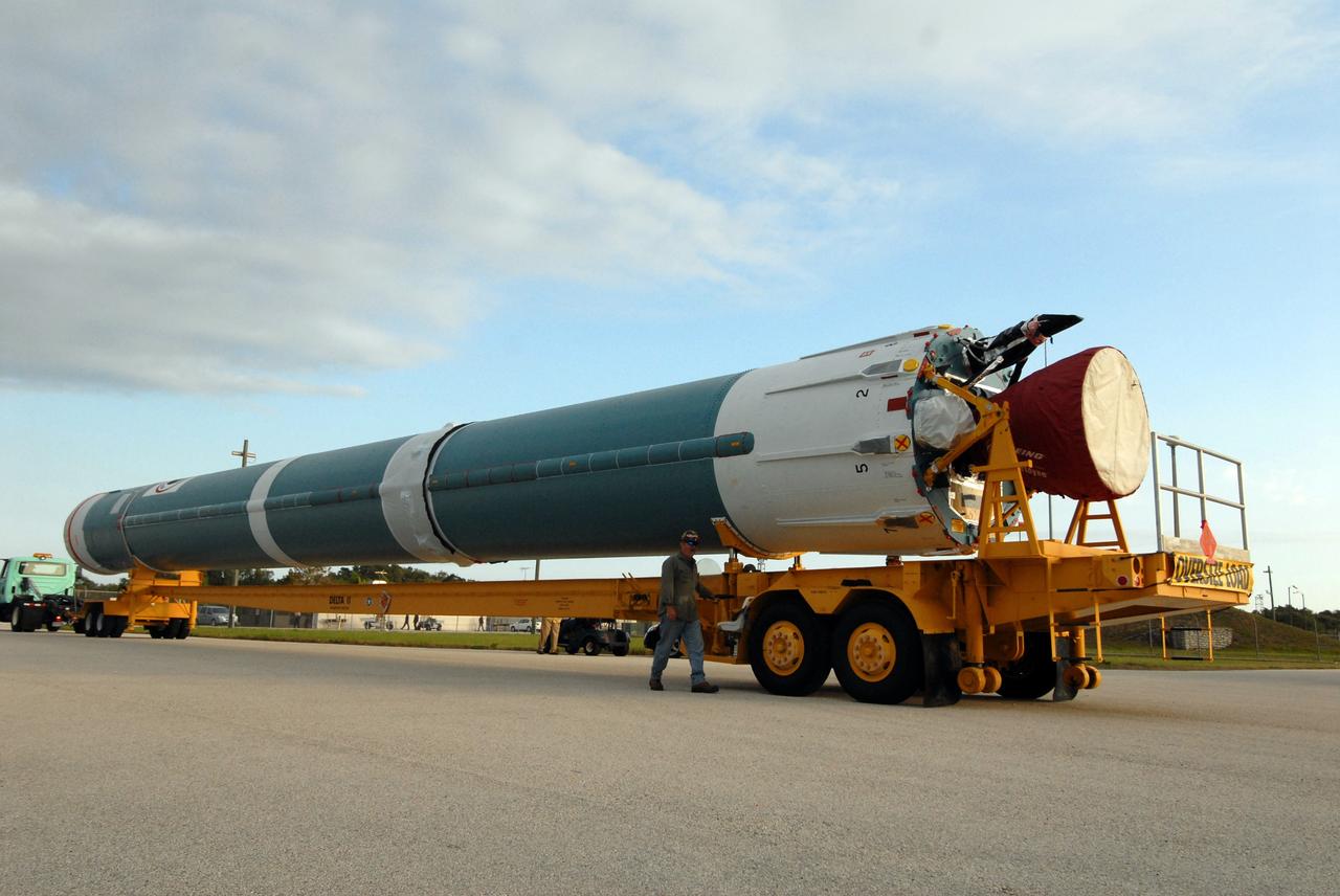 CAPE CANAVERAL, Fla. – The first stage of a Delta II rocket arrives on Cape Canaveral Air Force Station's Launch Complex 17-B in Florida.  The rocket is the launch vehicle for the STSS Demonstrators Program and will be raised and lifted into the mobile service tower for processing.  STSS Demonstrators Program is a midcourse tracking technology demonstrator and is part of an evolving ballistic missile defense system. STSS is capable of tracking objects after boost phase and provides trajectory information to other sensors. It will be launched by NASA for the Missile Defense Agency on July 29.  Photo credit: NASA/Jack Pfaller