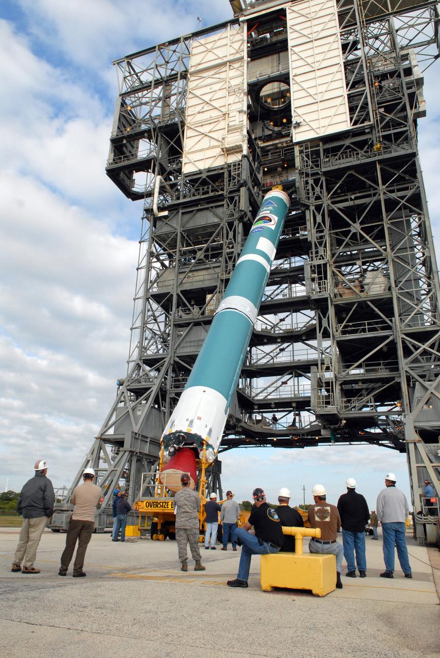 CAPE CANAVERAL, Fla. – On Cape Canaveral Air Force Station's Launch Complex 17-B in Florida, the first stage of a Delta II rocket is raised to vertical before it can be moved into the mobile service tower for processing. The rocket is the launch vehicle for the STSS Demonstrators Program.  STSS Demonstrators Program is a midcourse tracking technology demonstrator and is part of an evolving ballistic missile defense system. STSS is capable of tracking objects after boost phase and provides trajectory information to other sensors. It will be launched by NASA for the Missile Defense Agency on July 29.  Photo credit: NASA/Jack Pfaller