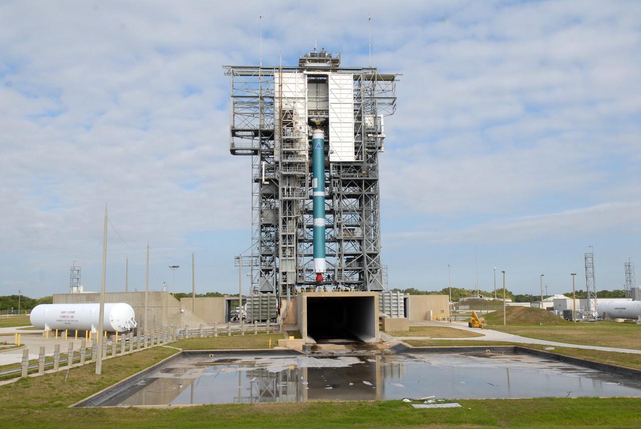 CAPE CANAVERAL, Fla. – On Cape Canaveral Air Force Station's Launch Complex 17-B in Florida, the first stage of a Delta II rocket is lifted into the mobile service tower. The rocket is the launch vehicle for the STSS Demonstrators Program.  STSS Demonstrators Program is a midcourse tracking technology demonstrator and is part of an evolving ballistic missile defense system. STSS is capable of tracking objects after boost phase and provides trajectory information to other sensors. It will be launched by NASA for the Missile Defense Agency on July 29.  Photo credit: NASA/Jack Pfaller