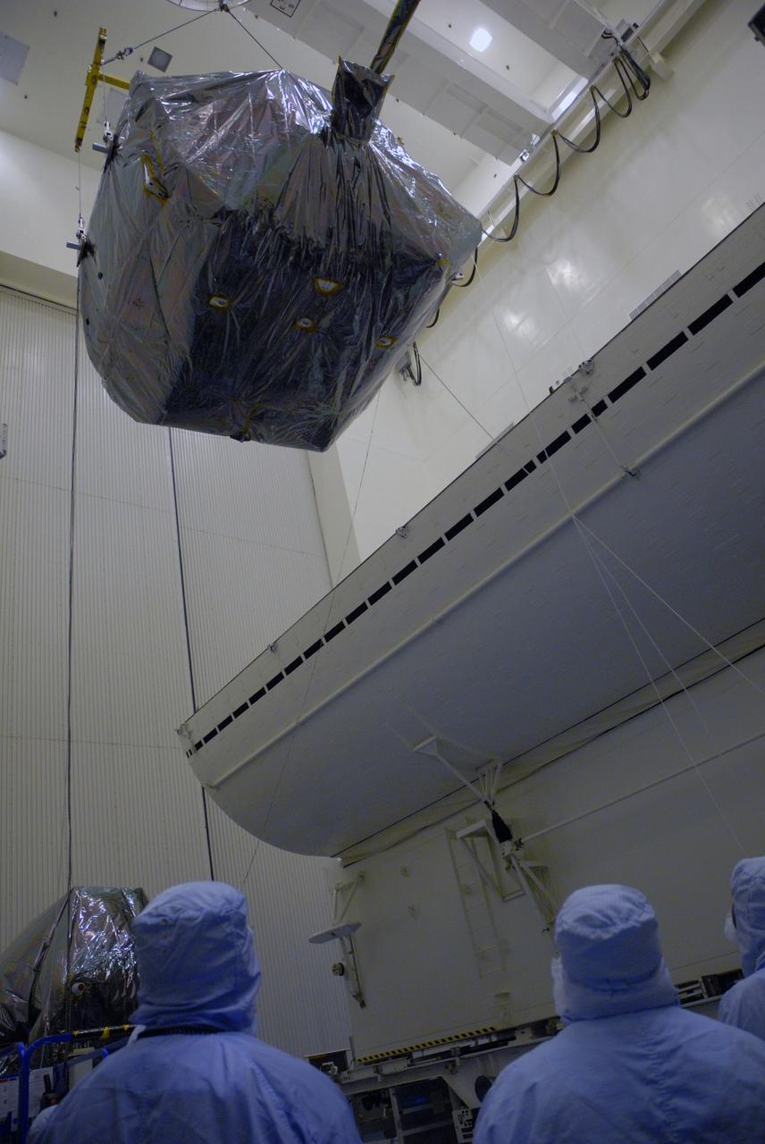 CAPE CANAVERAL, Fla. – In the Payload Hazardous Servicing Facility at NASA's Kennedy Space Center in Florida, the Orbital Replacement Unit Carrier, or ORUC, is lowered toward the payload canister.  The canister will deliver the ORUC and other carriers to Launch Pad 39A for installation in space shuttle Atlantis' payload bay. Atlantis' 11-day flight to service NASA's Hubble Space Telescope is targeted for launch May 12.  The mission will include five spacewalks in which astronauts will refurbish and upgrade the telescope with state-of-the-art science instruments. As a result, Hubble's capabilities will be expanded and its operational lifespan extended through at least 2014.    Photo credit: NASA/Tim Jacobs