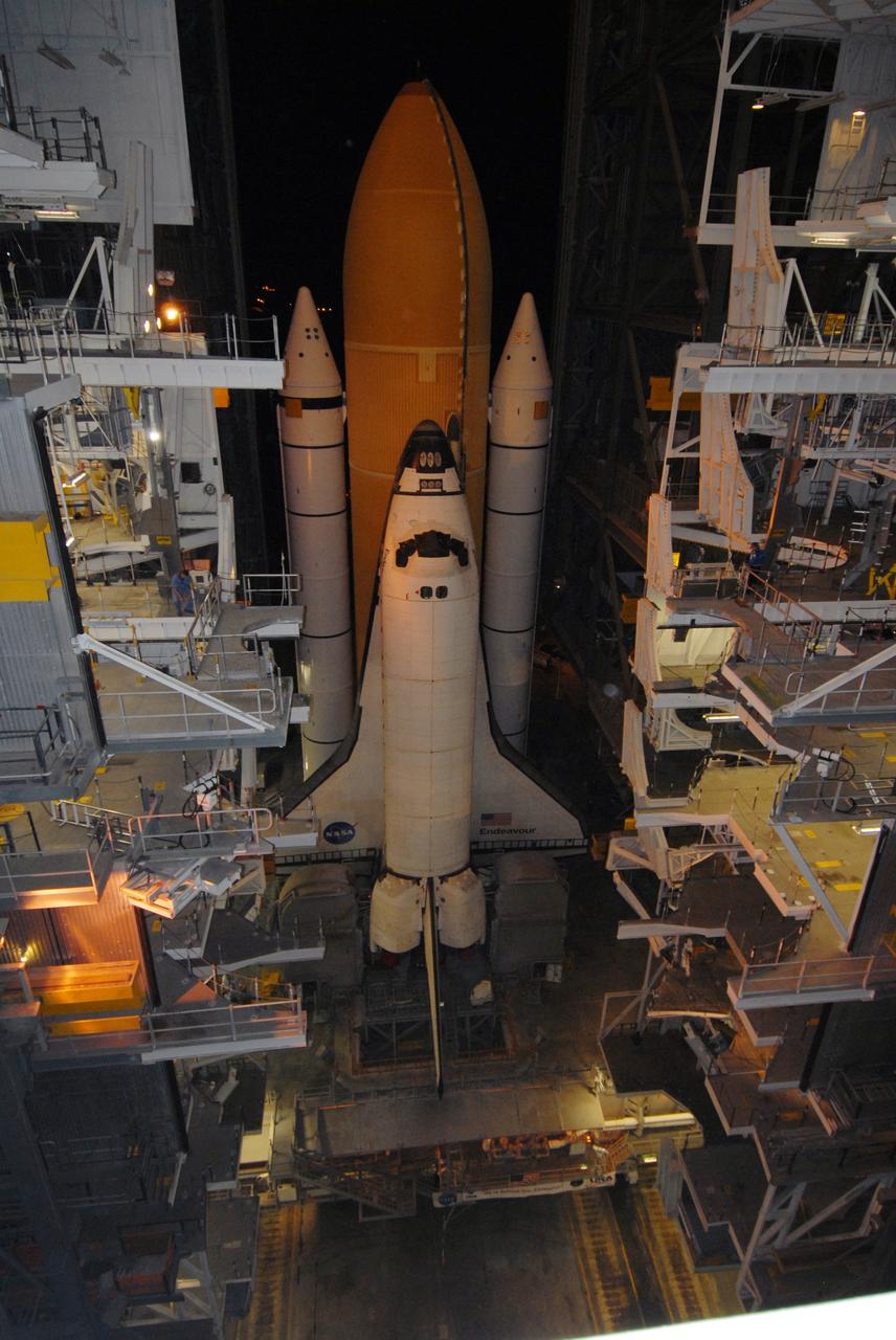 CAPE CANAVERAL, Fla. – Space shuttle Endeavour, installed on the mobile launcher platform atop the crawler-transporter, moves out of the Vehicle Assembly Building for rollout to Launch Pad 39B at NASA's Kennedy Space Center in Florida. First motion was at 11:57 p.m. EDT April 16. The 4.2-mile journey is expected to take approximately 7 hours. Endeavour will be prepared on the pad for liftoff in the unlikely event that a rescue mission is necessary following space shuttle Atlantis' launch on the STS-125 mission to service NASA's Hubble Space Telescope. After Atlantis is cleared to land, Endeavour will move to Launch Pad 39A for its upcoming STS-127 mission to the International Space Station, targeted to launch June 13. Photo credit: NASA/Jack Pfaller