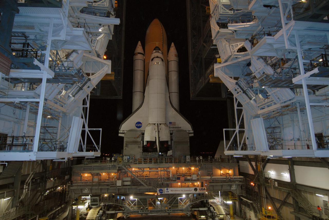 CAPE CANAVERAL, Fla. – Space shuttle Endeavour, installed on the mobile launcher platform atop the crawler-transporter, moves out of the Vehicle Assembly Building for rollout to Launch Pad 39B at NASA's Kennedy Space Center in Florida. First motion was at 11:57 p.m. EDT April 16. The 4.2-mile journey is expected to take approximately 7 hours. Endeavour will be prepared on the pad for liftoff in the unlikely event that a rescue mission is necessary following space shuttle Atlantis' launch on the STS-125 mission to service NASA's Hubble Space Telescope. After Atlantis is cleared to land, Endeavour will move to Launch Pad 39A for its upcoming STS-127 mission to the International Space Station, targeted to launch June 13. Photo credit: NASA/Jack Pfaller