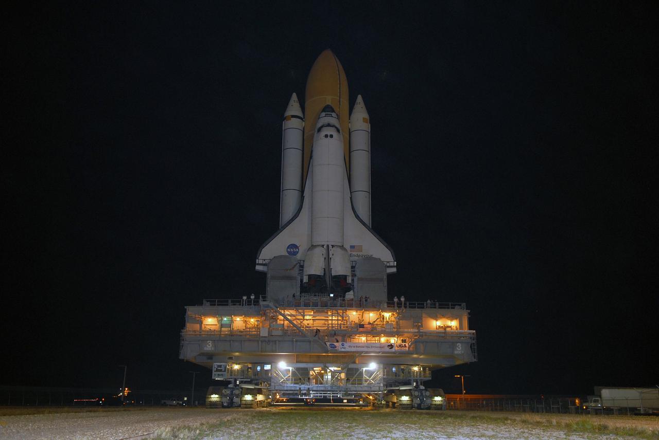 CAPE CANAVERAL, Fla. – Space shuttle Endeavour, installed on the mobile launcher platform atop the crawler-transporter, moves along the crawlerway at NASA's Kennedy Space Center in Florida as it rolls out to Launch Pad 39B. First motion was at 11:57 p.m. EDT April 16. The 4.2-mile journey is expected to take approximately 7 hours. Endeavour will be prepared on the pad for liftoff in the unlikely event that a rescue mission is necessary following space shuttle Atlantis' launch on the STS-125 mission to service NASA's Hubble Space Telescope. After Atlantis is cleared to land, Endeavour will move to Launch Pad 39A for its upcoming STS-127 mission to the International Space Station, targeted to launch June 13. Photo credit: NASA/Jack Pfaller