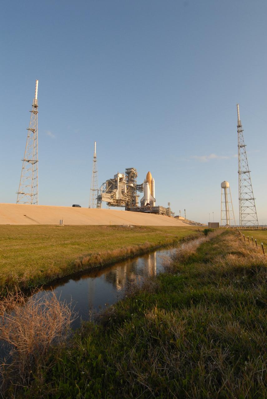 CAPE CANAVERAL, Fla. – Space shuttle Endeavour stands tall and proud on Launch Pad 39B at NASA's Kennedy Space Center in Florida. First motion of Endeavour's rollout from the Vehicle Assembly Building was at 11:57 p.m. EDT April 16. Surrounding the pad (seen left and right) are the new lightning towers erected for NASA's Constellation Program, which will use the pad for Ares rocket launches. Endeavour will be prepared on the pad for liftoff in the unlikely event that a rescue mission is necessary following space shuttle Atlantis' launch on the STS-125 mission to service NASA's Hubble Space Telescope. After Atlantis is cleared to land, Endeavour will move to Launch Pad 39A for its upcoming STS-127 mission to the International Space Station, targeted to launch June 13. Photo credit: NASA/Jack Pfaller